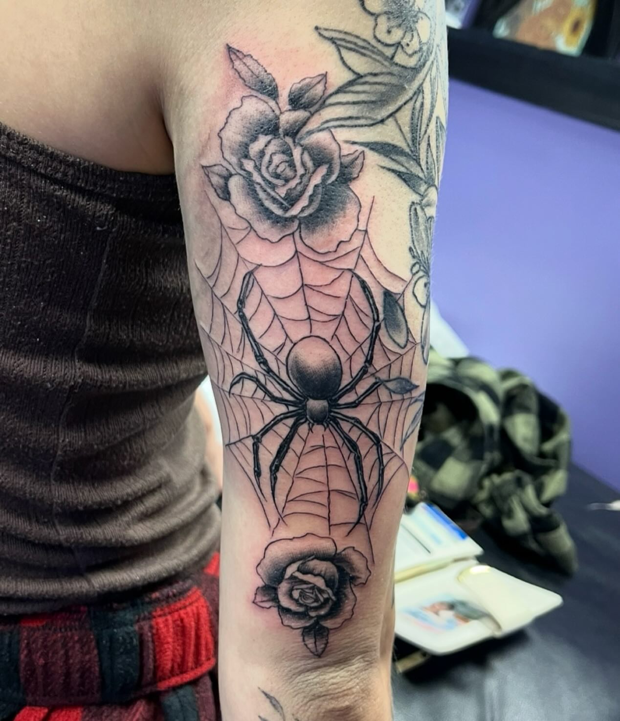 Spider and roses realism tattoo on the forearm by Mark Calloway