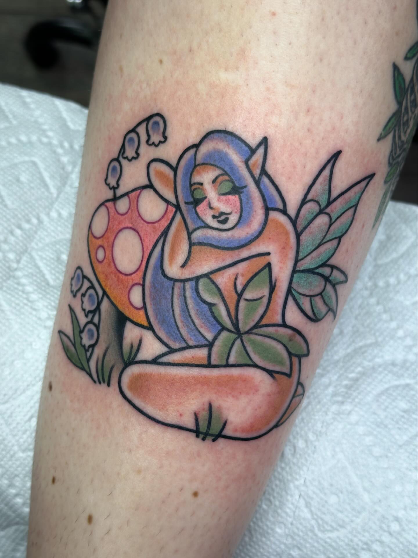 Elf with mushroom new school tattoo on the forearm by Ginny Marie Kalnasy