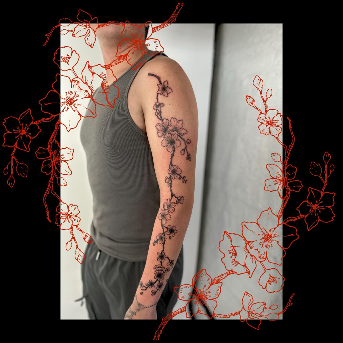 Cherry blossom vine black and grey tattoo on the upper arm by Lip™