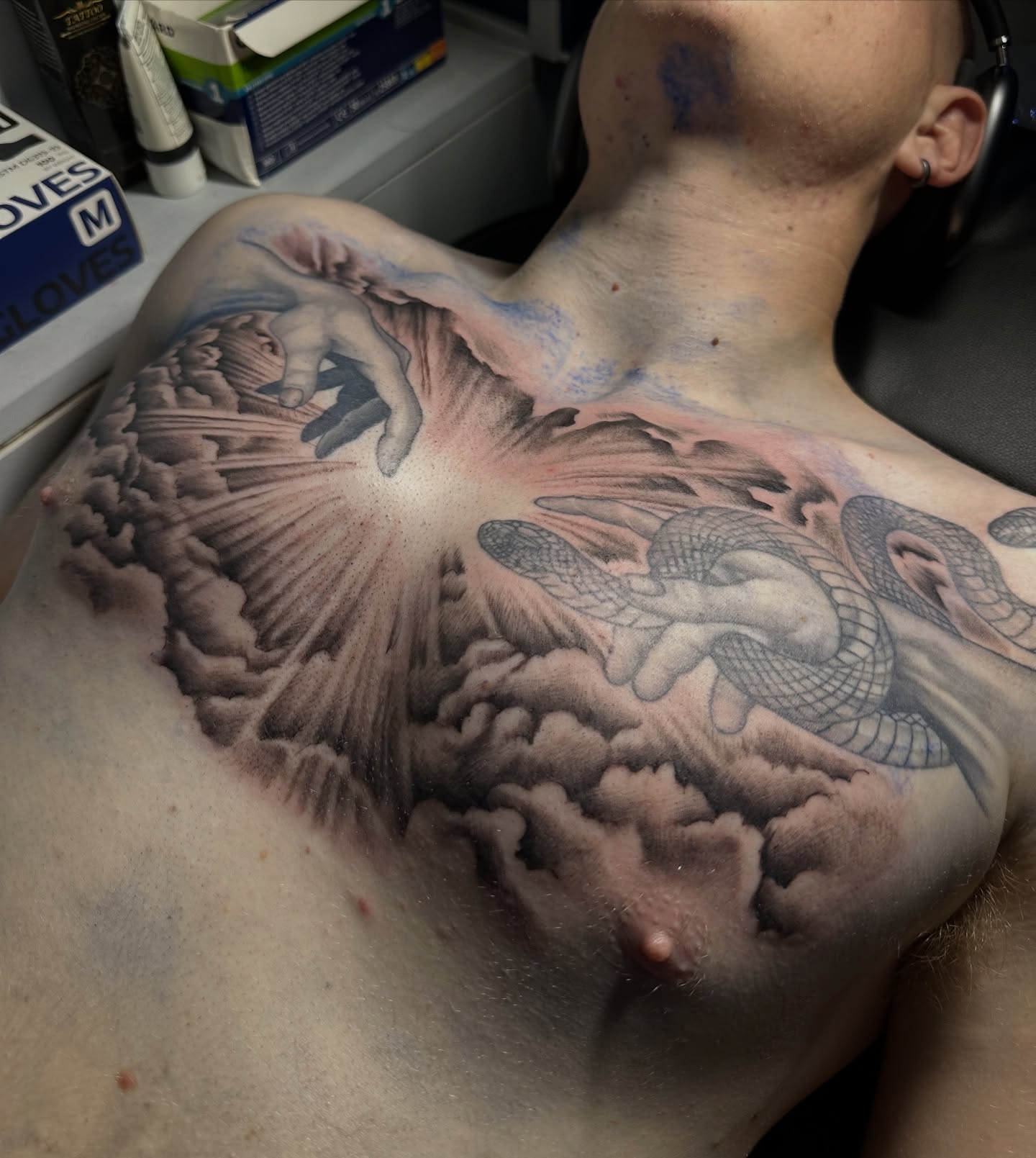Snake and angel realism tattoo on the chest by Chris (Pikasso)
