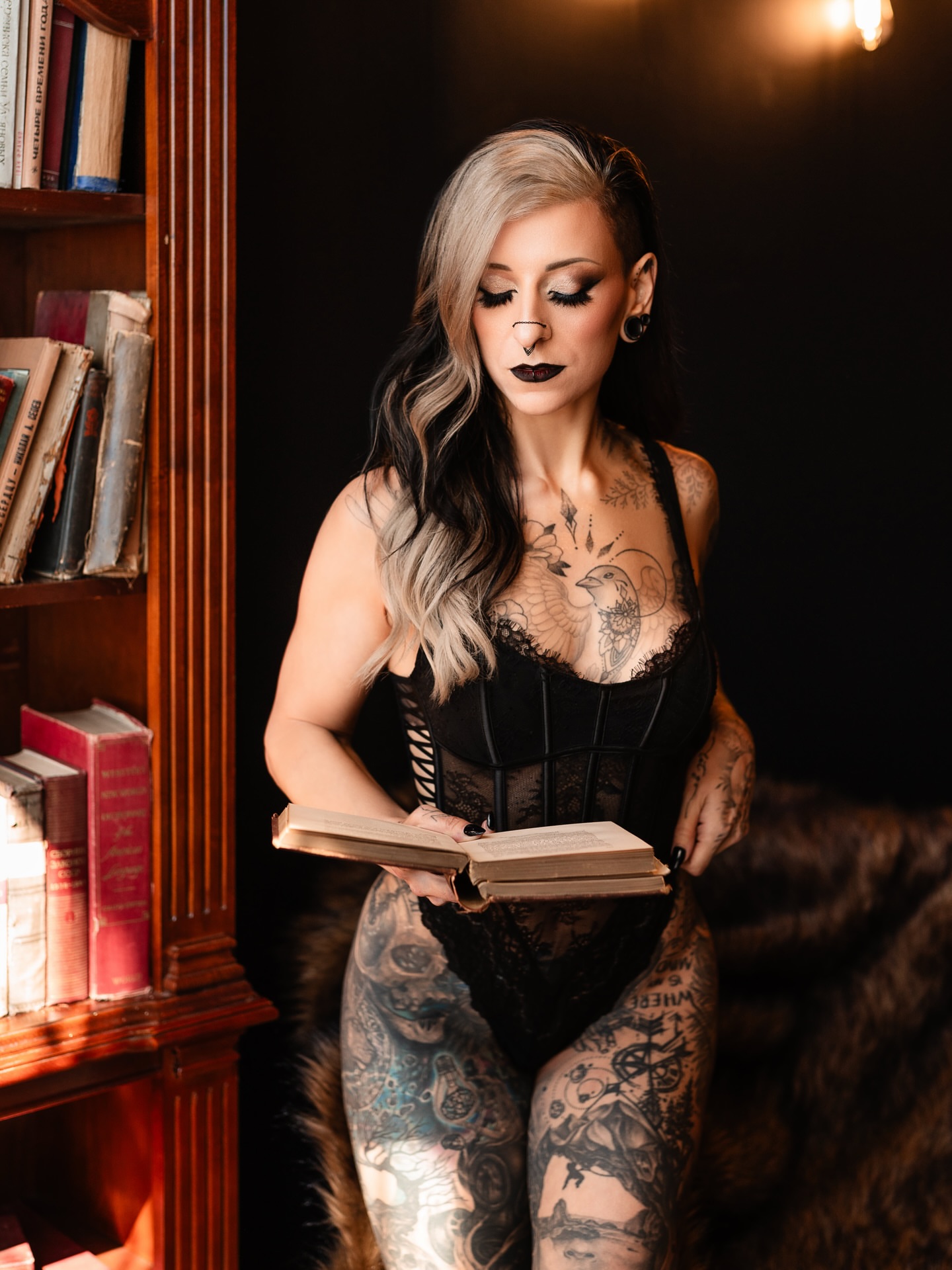 Book black and grey tattoo on the torso by Jax Citriglia
