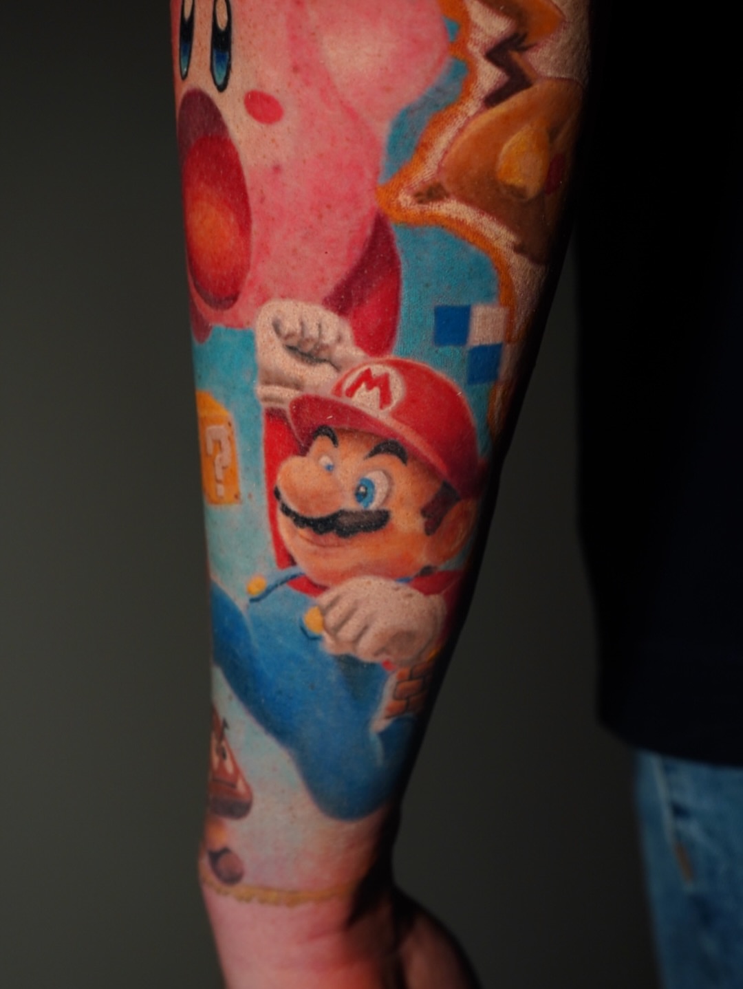 Mario realism tattoo on the forearm by Benjamin Xavier Valadez