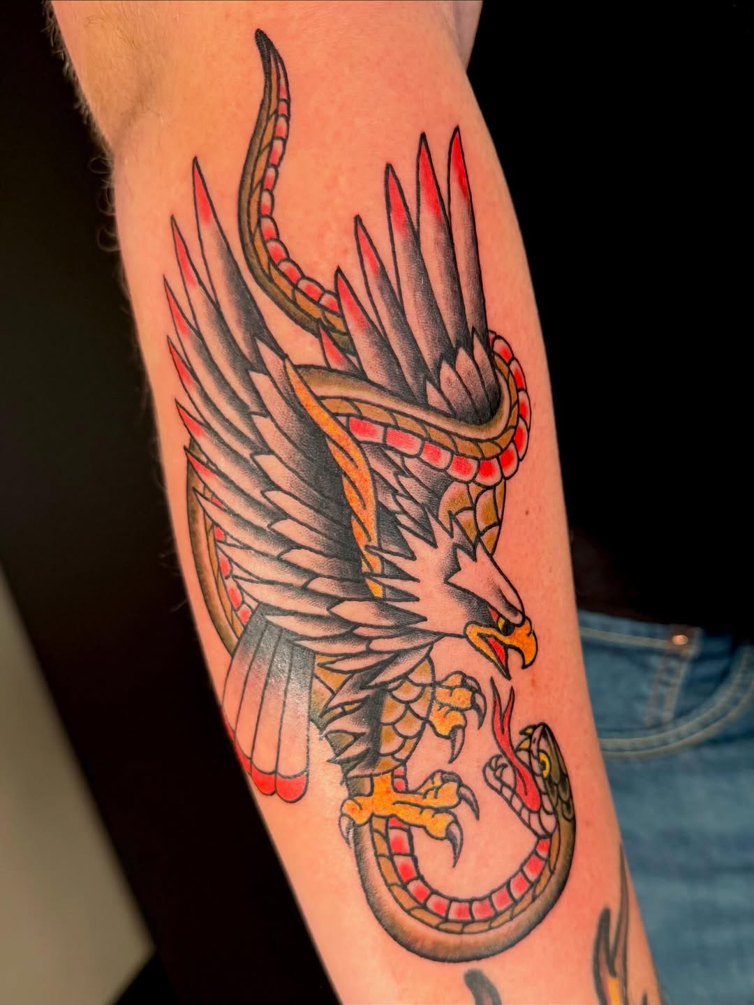 Eagle fighting snake American traditional tattoo on the forearm by Alaska ⚜️