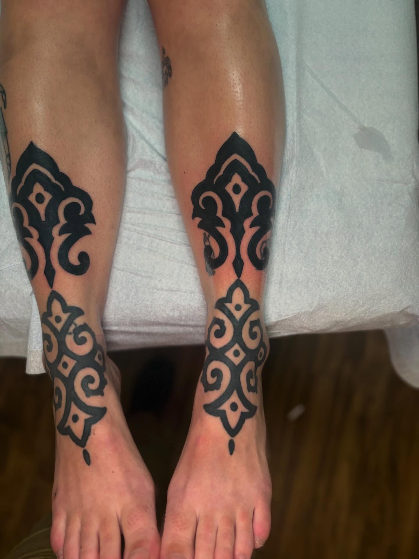 Geometric pattern geometric tattoo on the calf by Lauren Deets