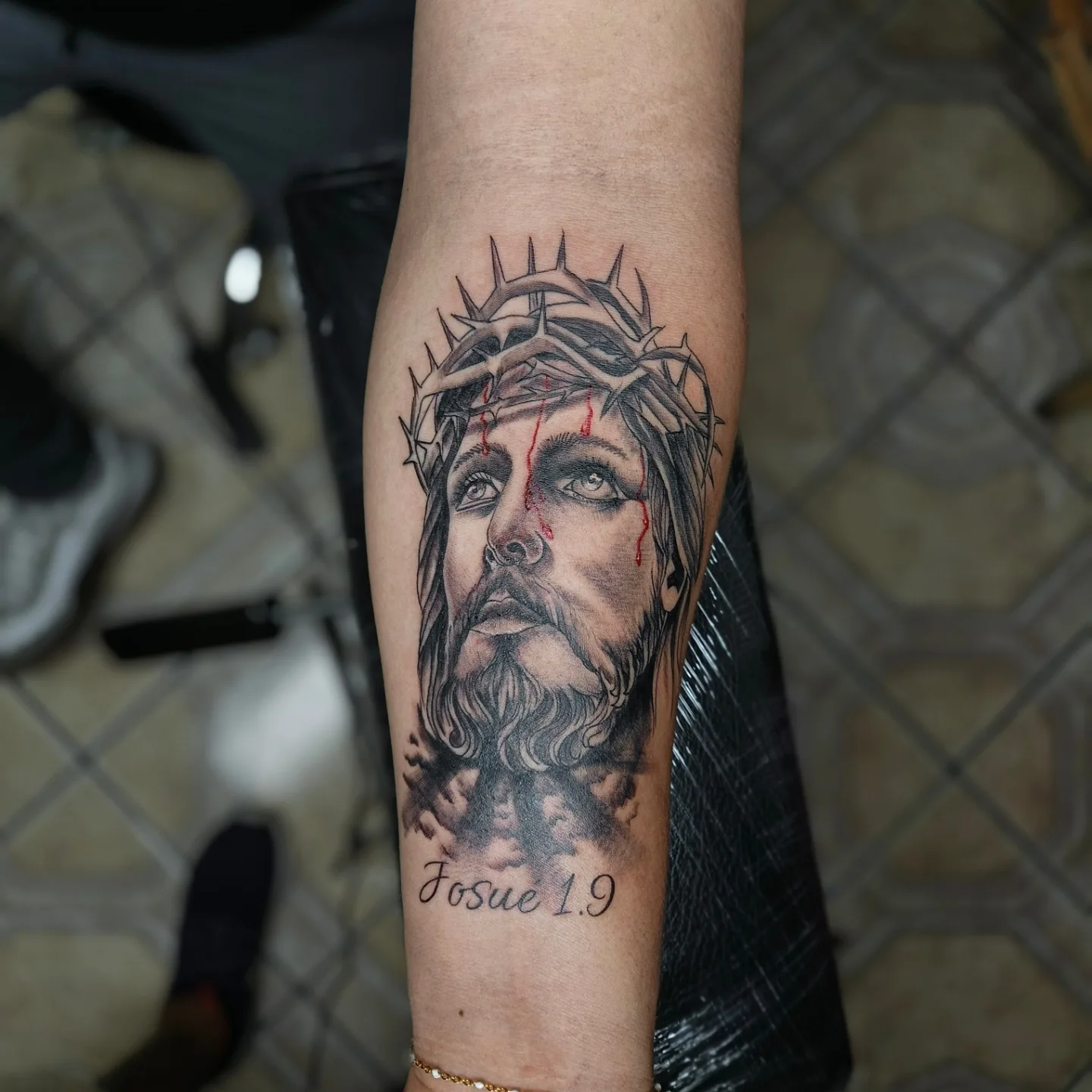 Jesus Christ realism tattoo on the forearm by Alexander Tattooink