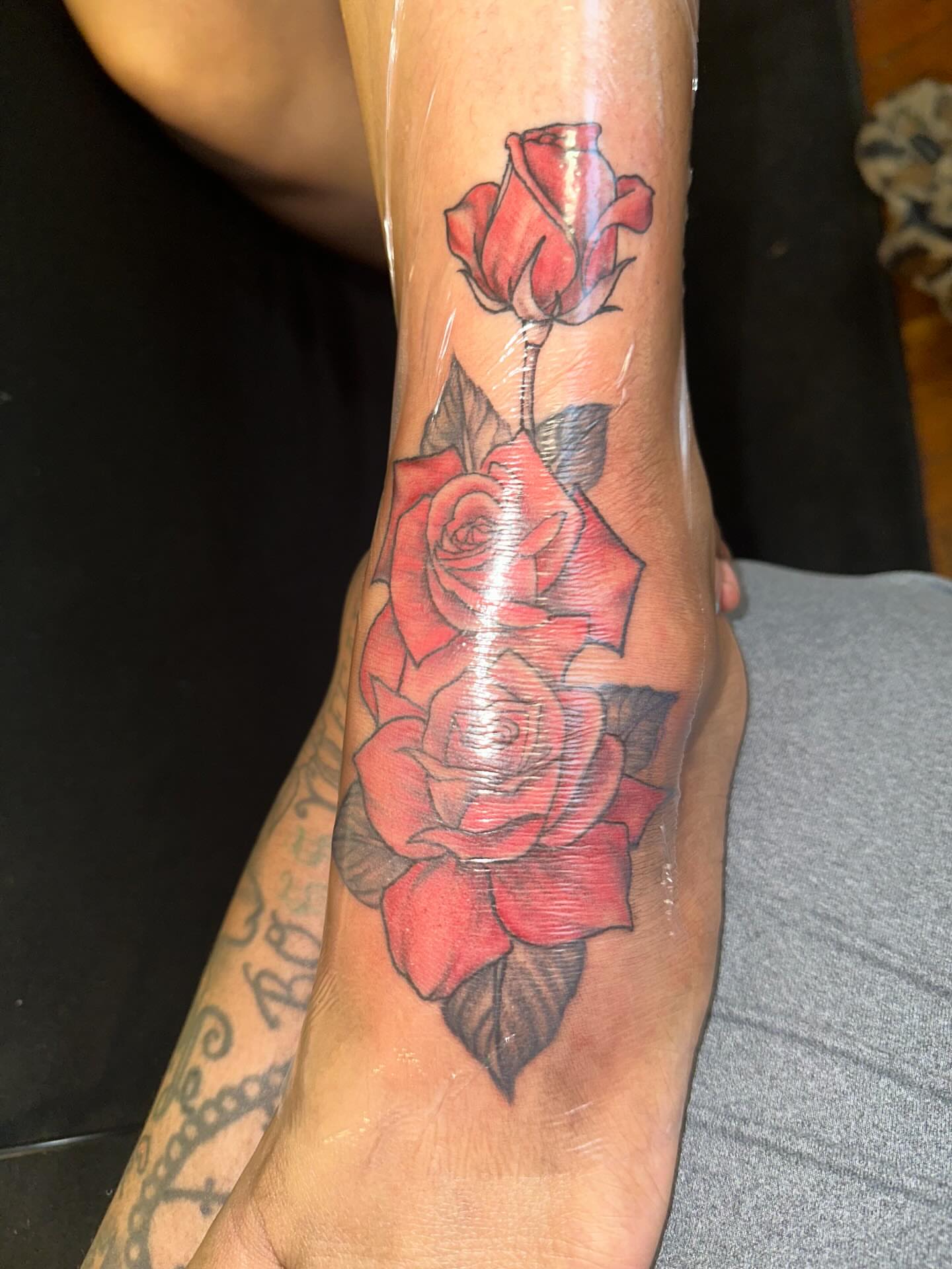 Roses realism tattoo on the forearm by Aja Marie