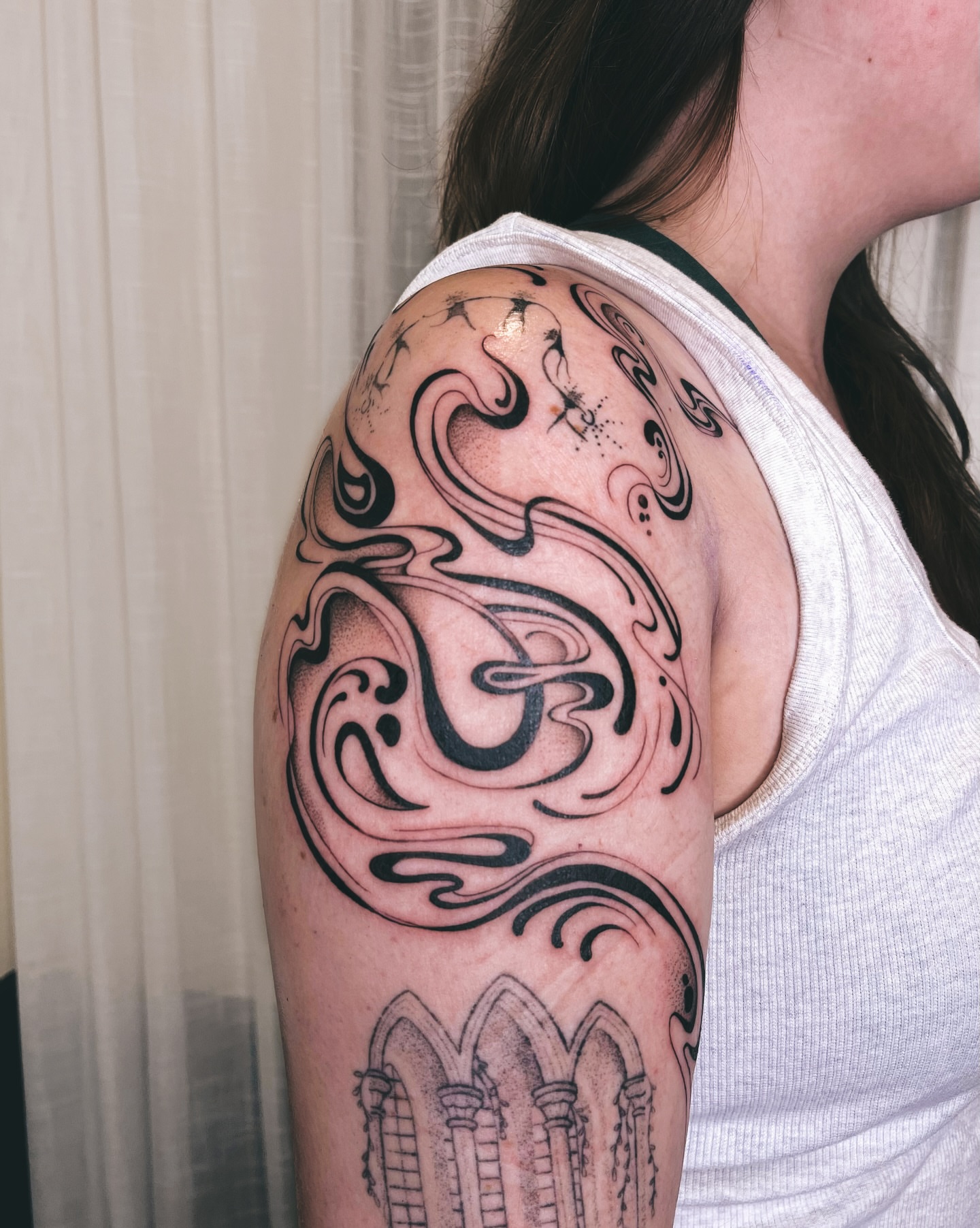 Swirls and arches tribal tattoo on the shoulder by Kyla Jae