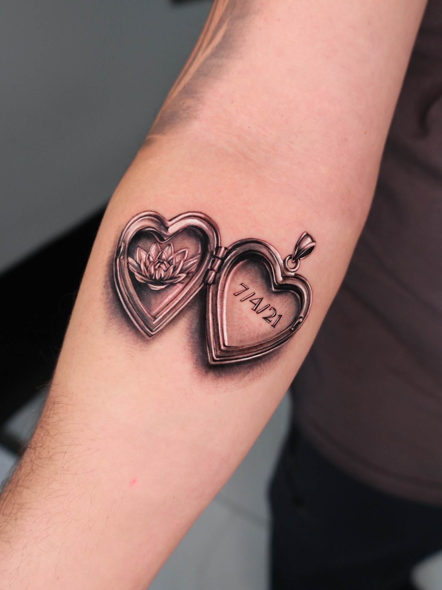 Heart locket realism tattoo on the forearm by Bay Area Tattoo Artist