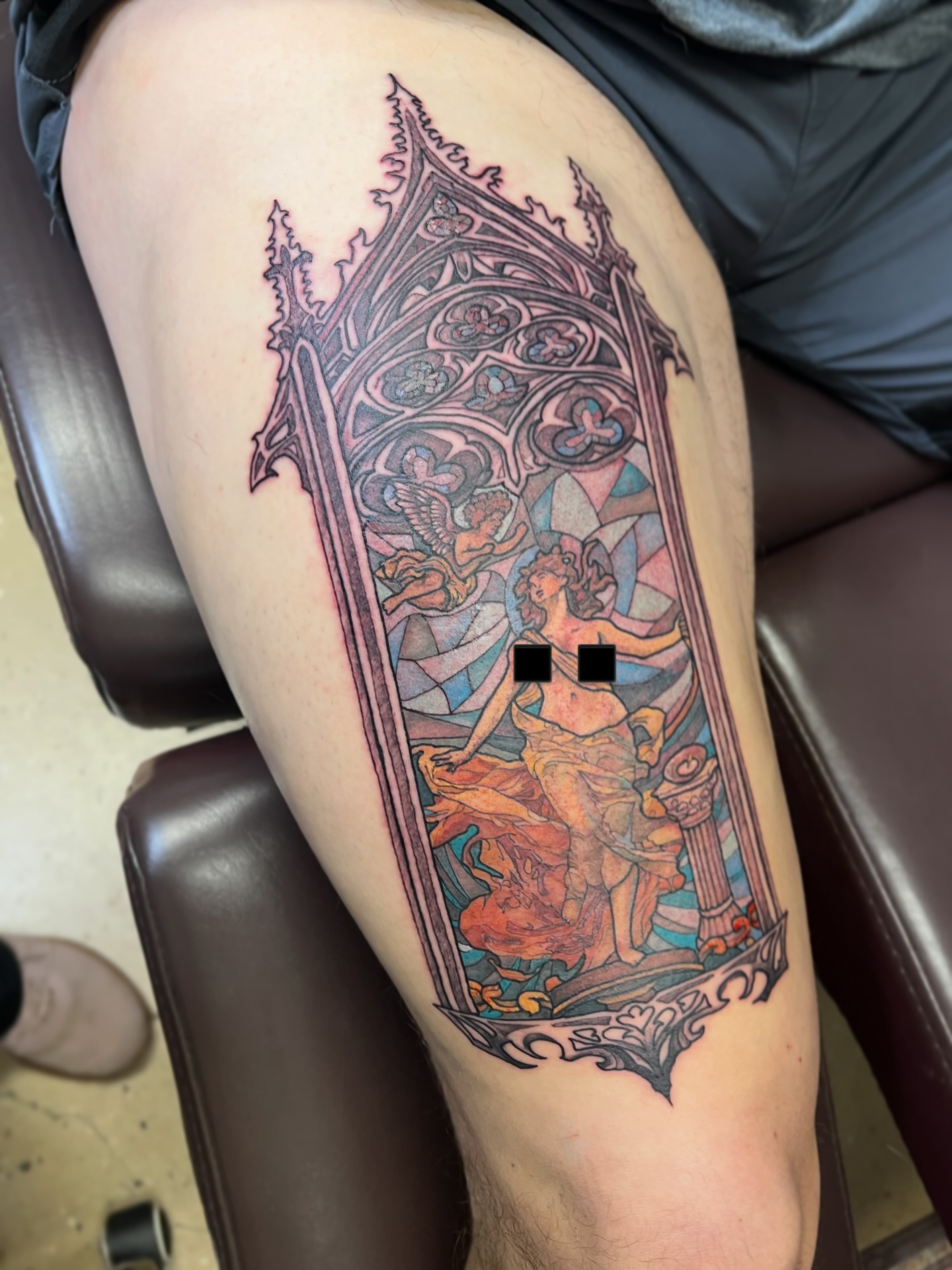 Stained glass window illustrative tattoo on the thigh by Tabitha Mathis