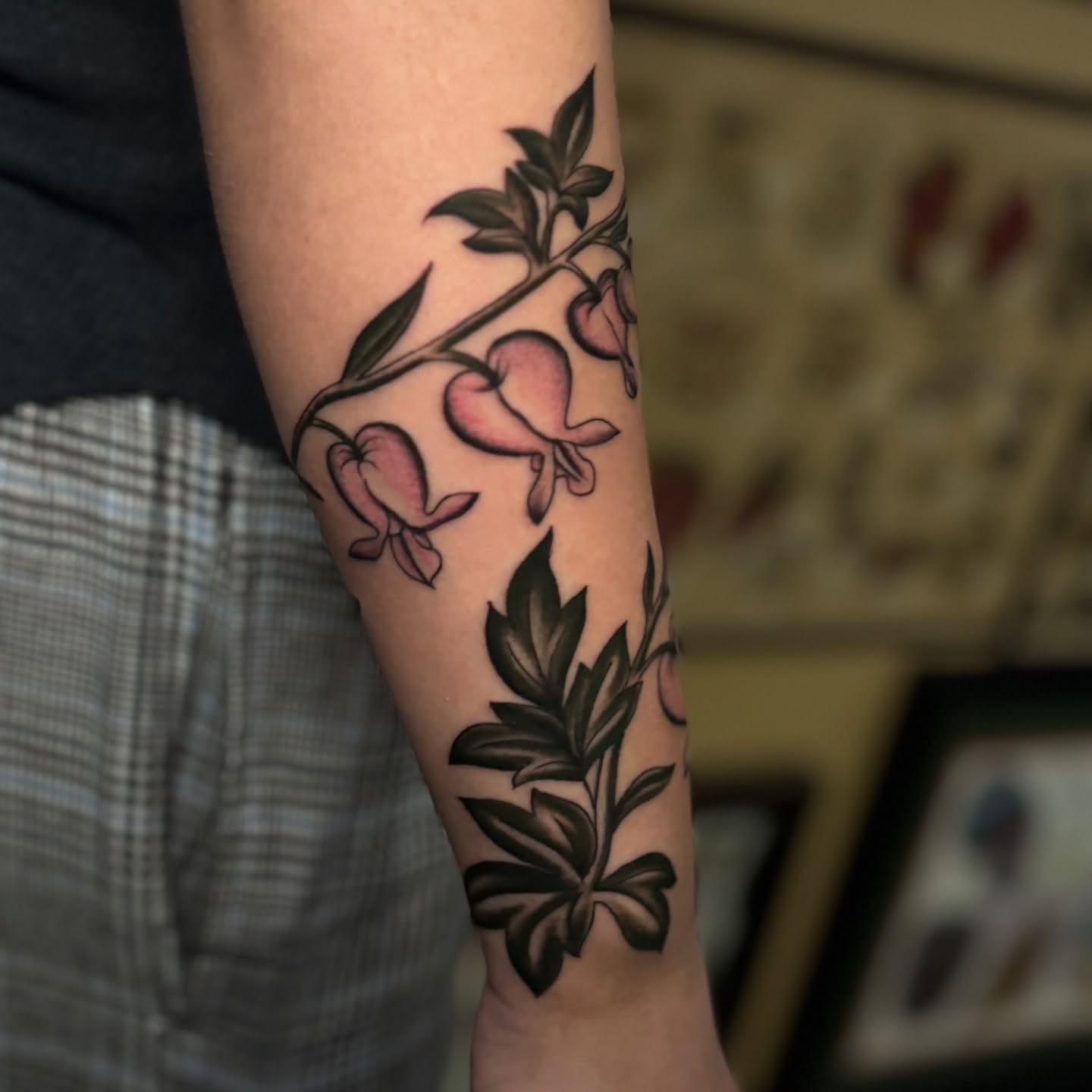 Peach blossoms neo-traditional tattoo on the forearm by Bre