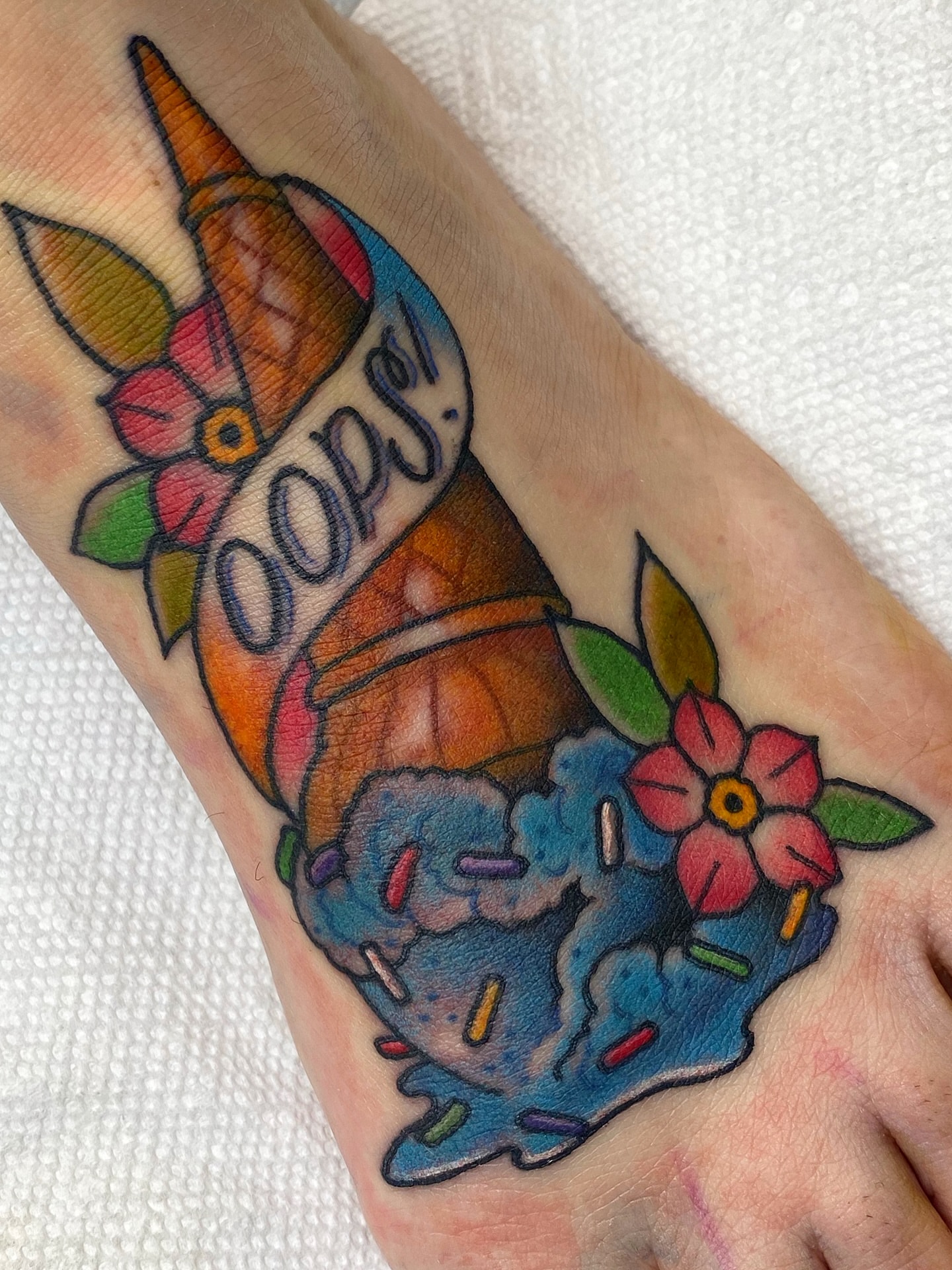 Ice cream cone American traditional tattoo on the forearm by Stacey Martin Smith
