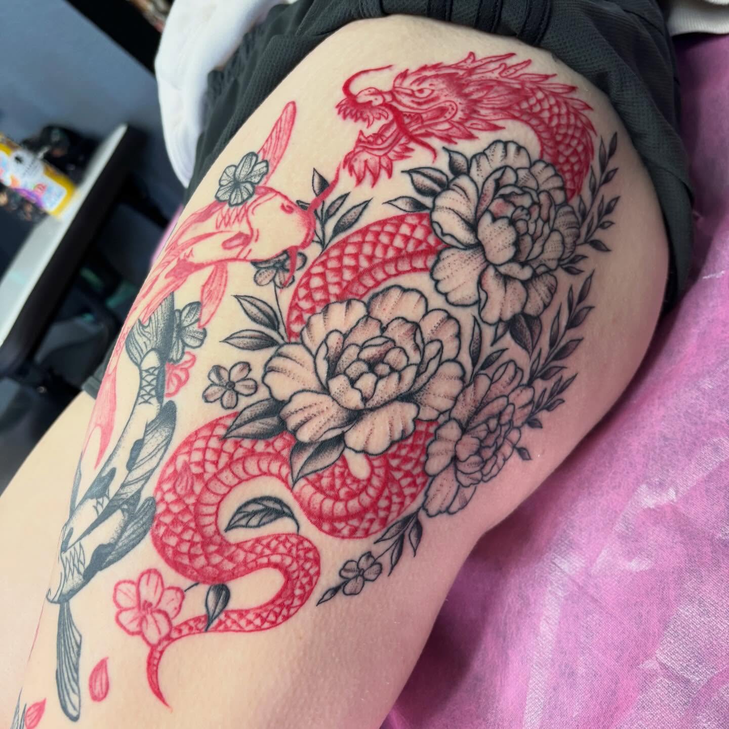 Dragon and peonies American traditional tattoo on the thigh by 18 and older High End Tattoo