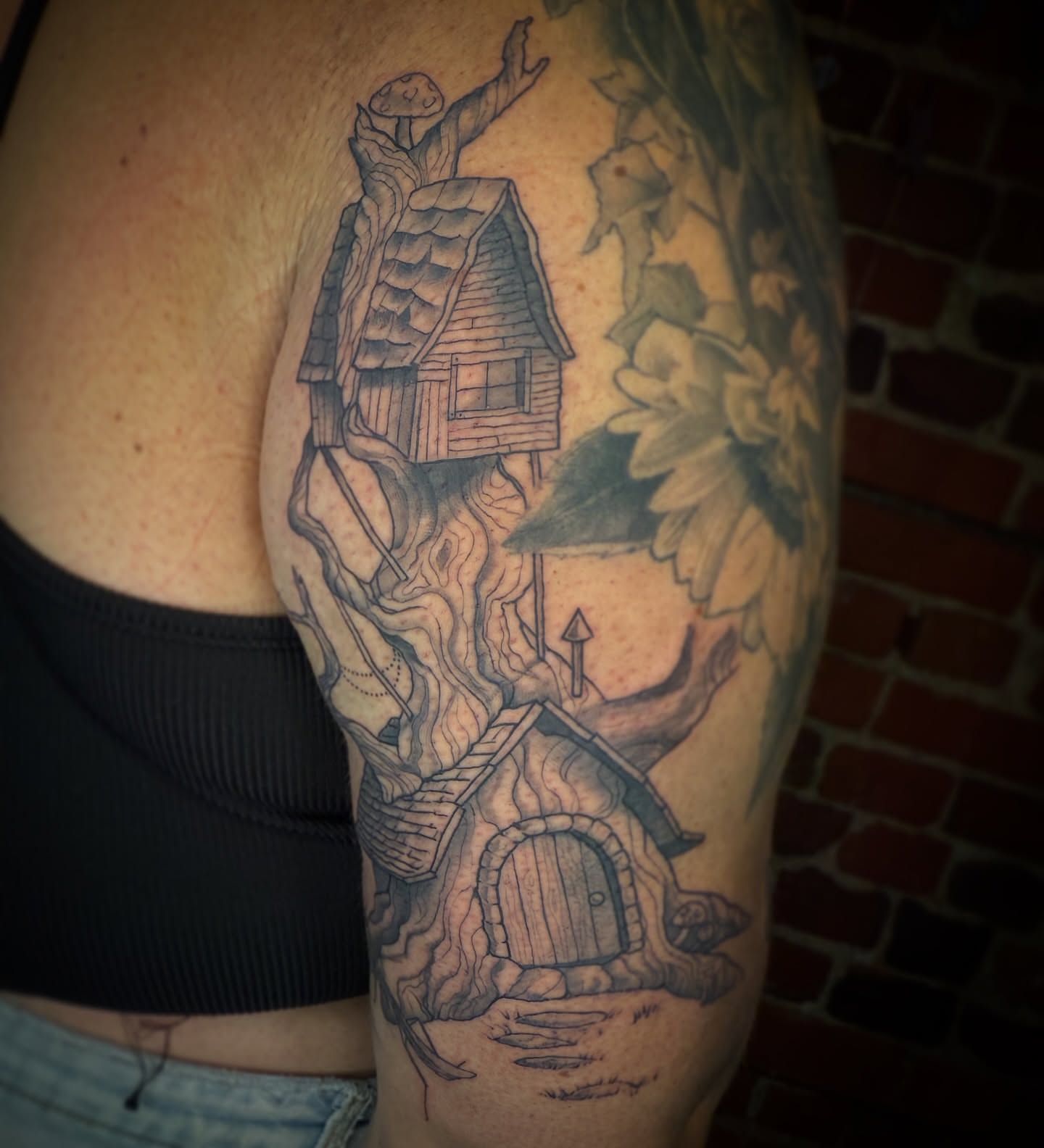 Treehouse and mushroom realism tattoo on the shoulder by Francis Hagendorn, Toronto, Ontario