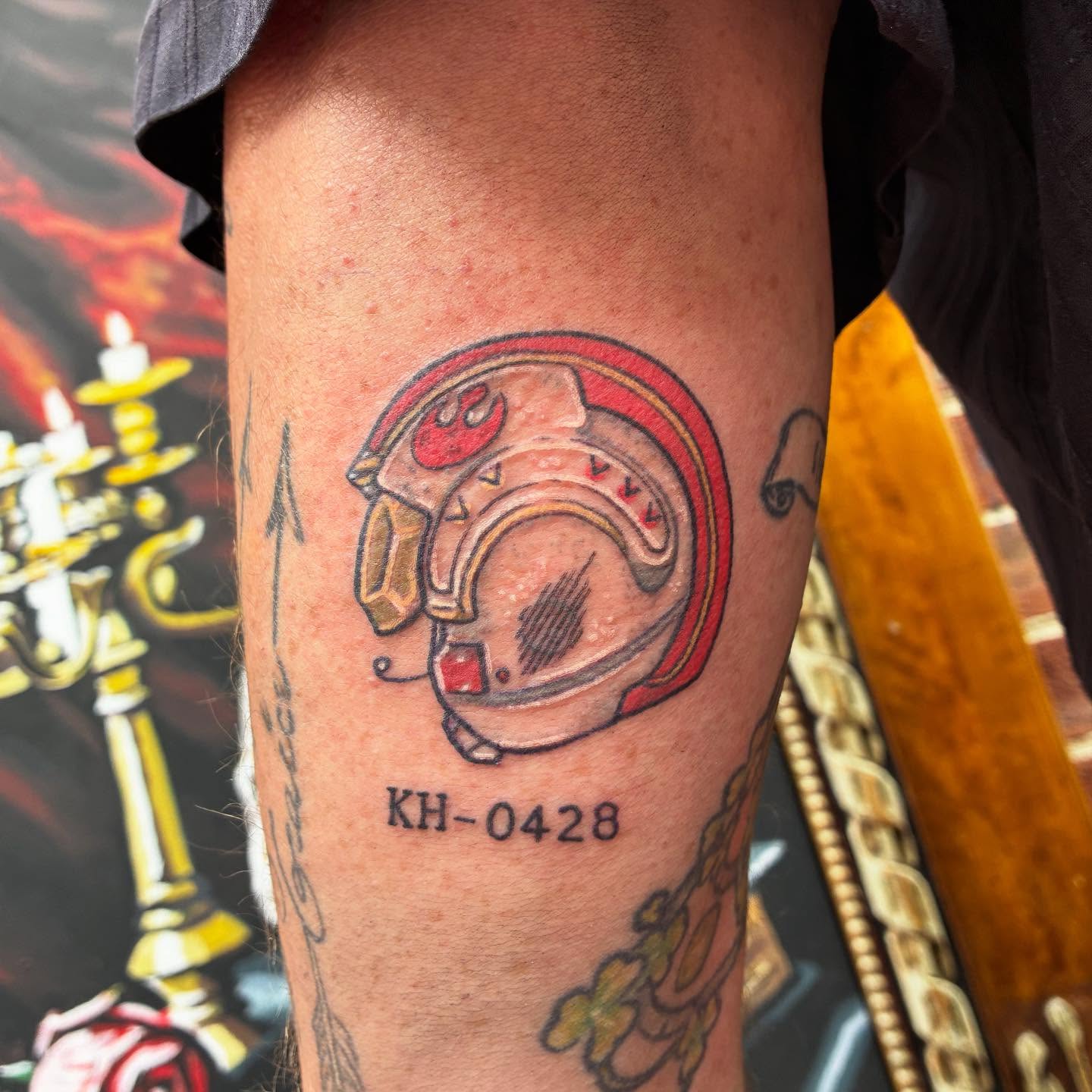Helmet anime tattoo on the forearm by Chris Hornsby