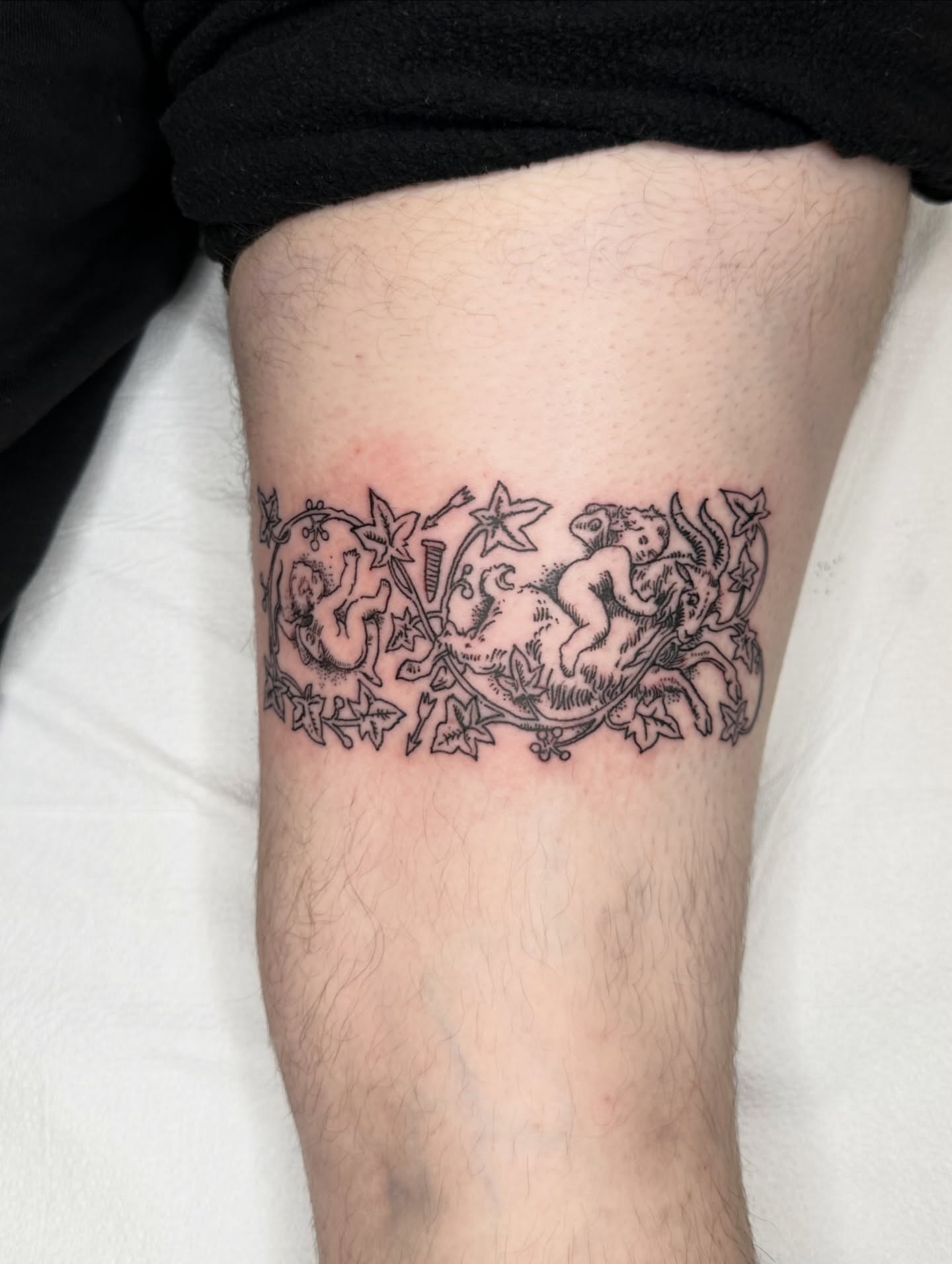 Cherubs and ivy black and grey tattoo on the forearm by πΈππππππ