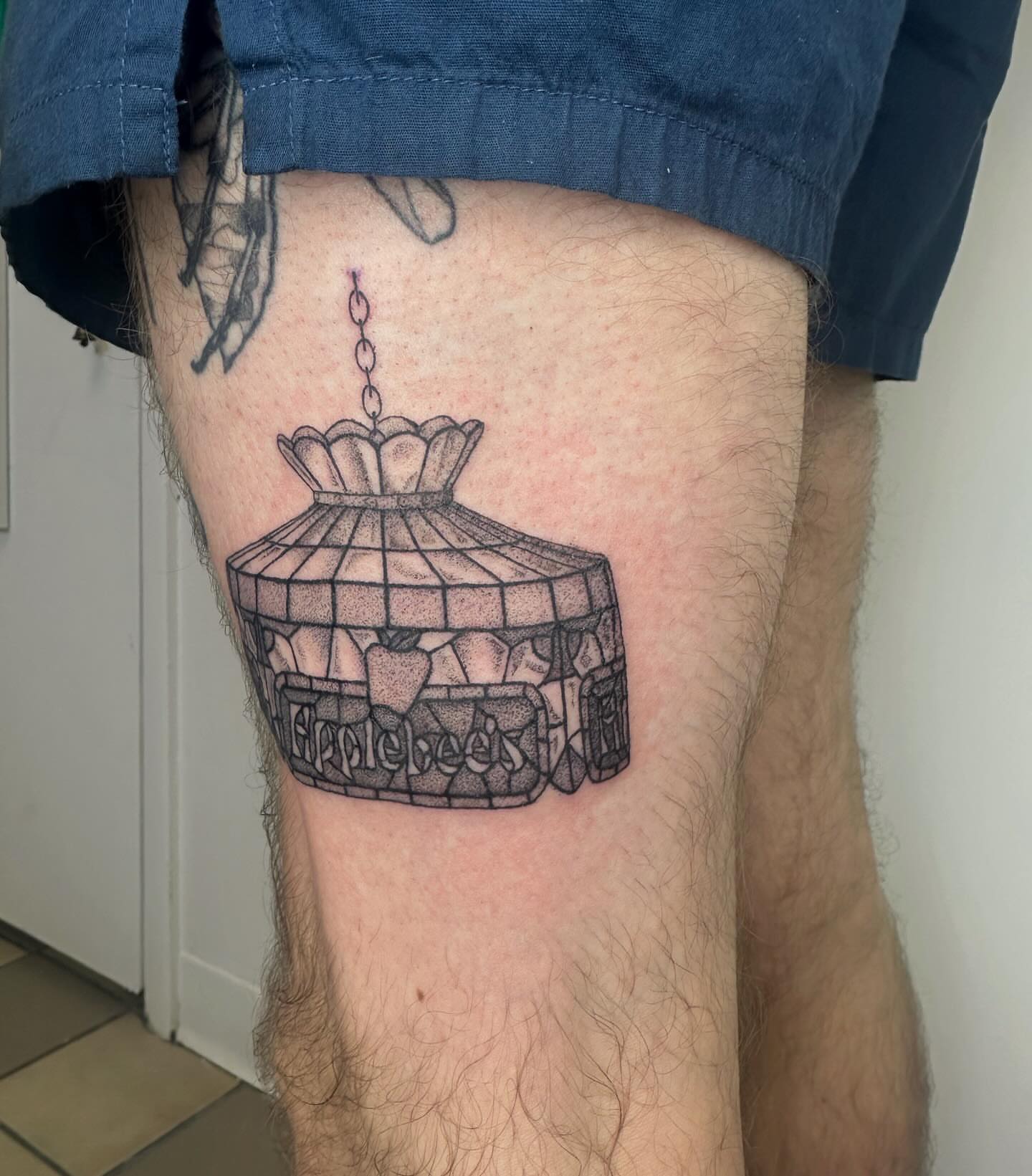 Stained glass window black and grey tattoo on the thigh by J Valentin