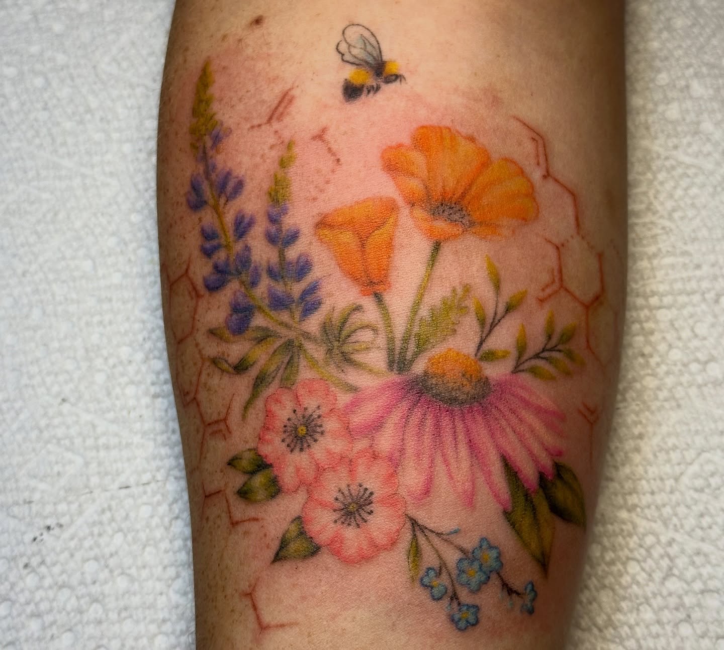 Floral bouquet new school tattoo on the forearm by Lauren DeLizza