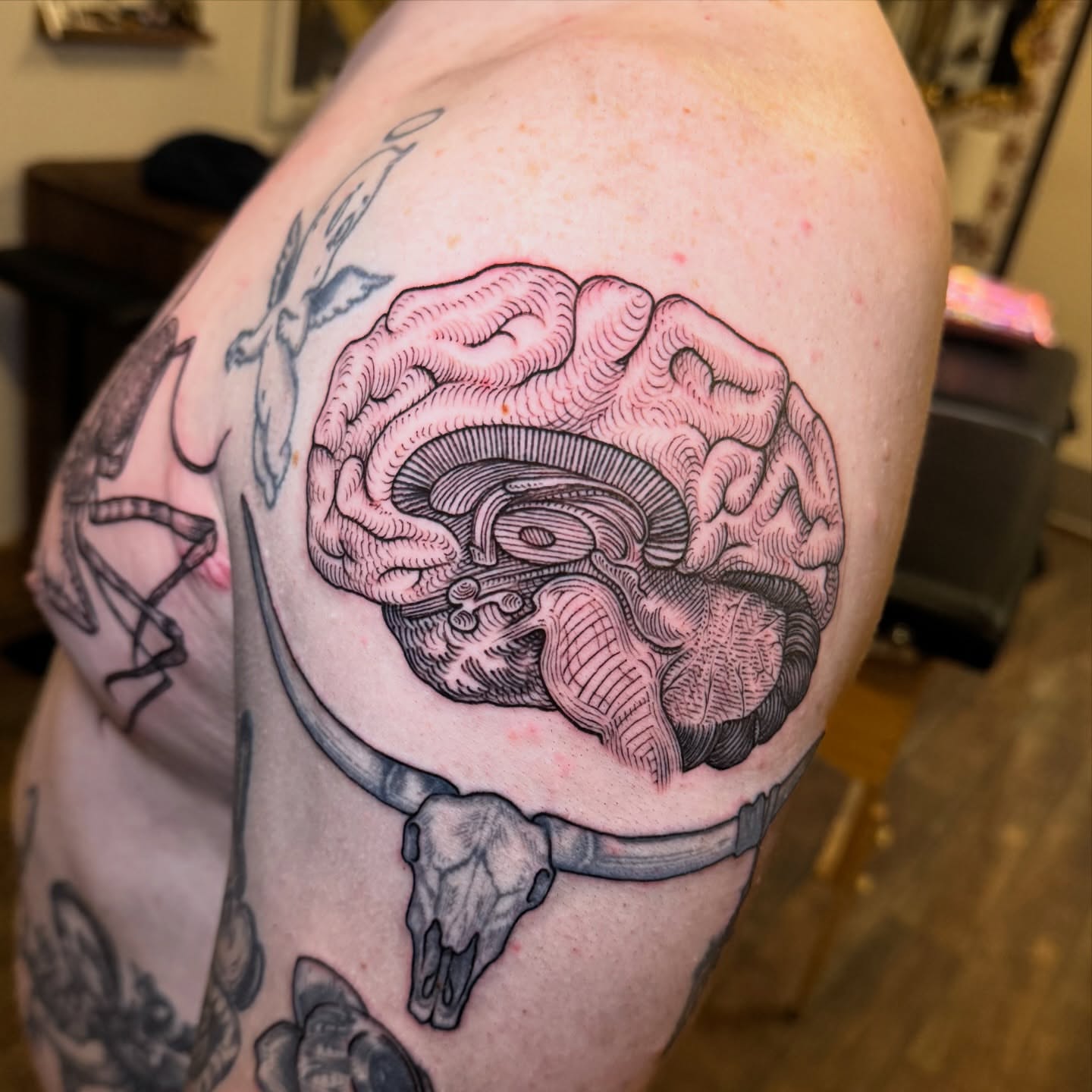 Brain realism tattoo on the shoulder by Landon Morgan
