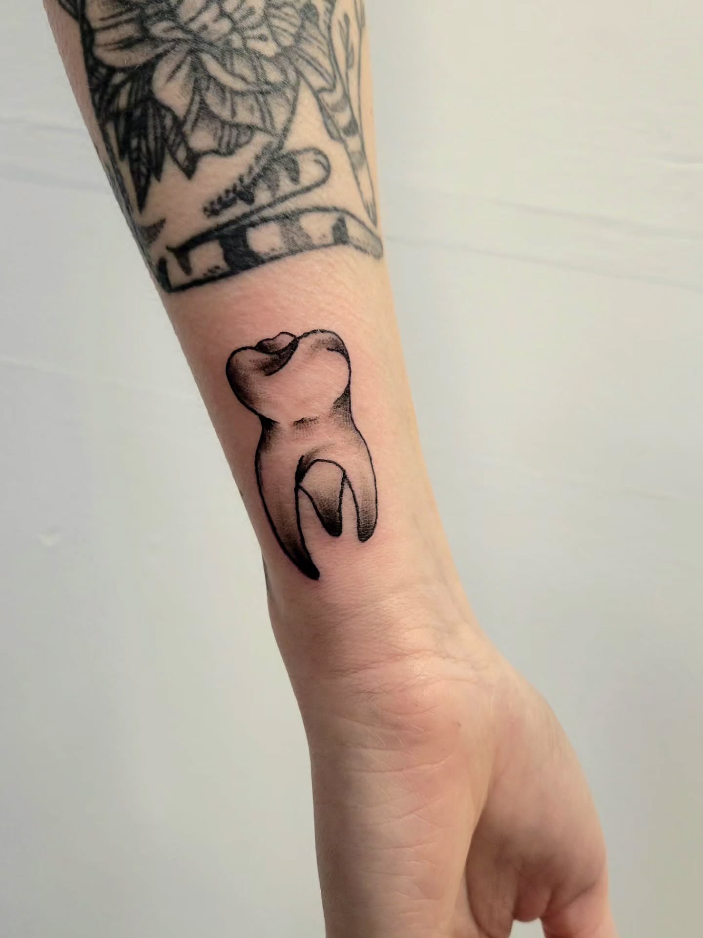 Tooth black and grey tattoo on the forearm by Kyle - Portland Oregon Tattoo Artist