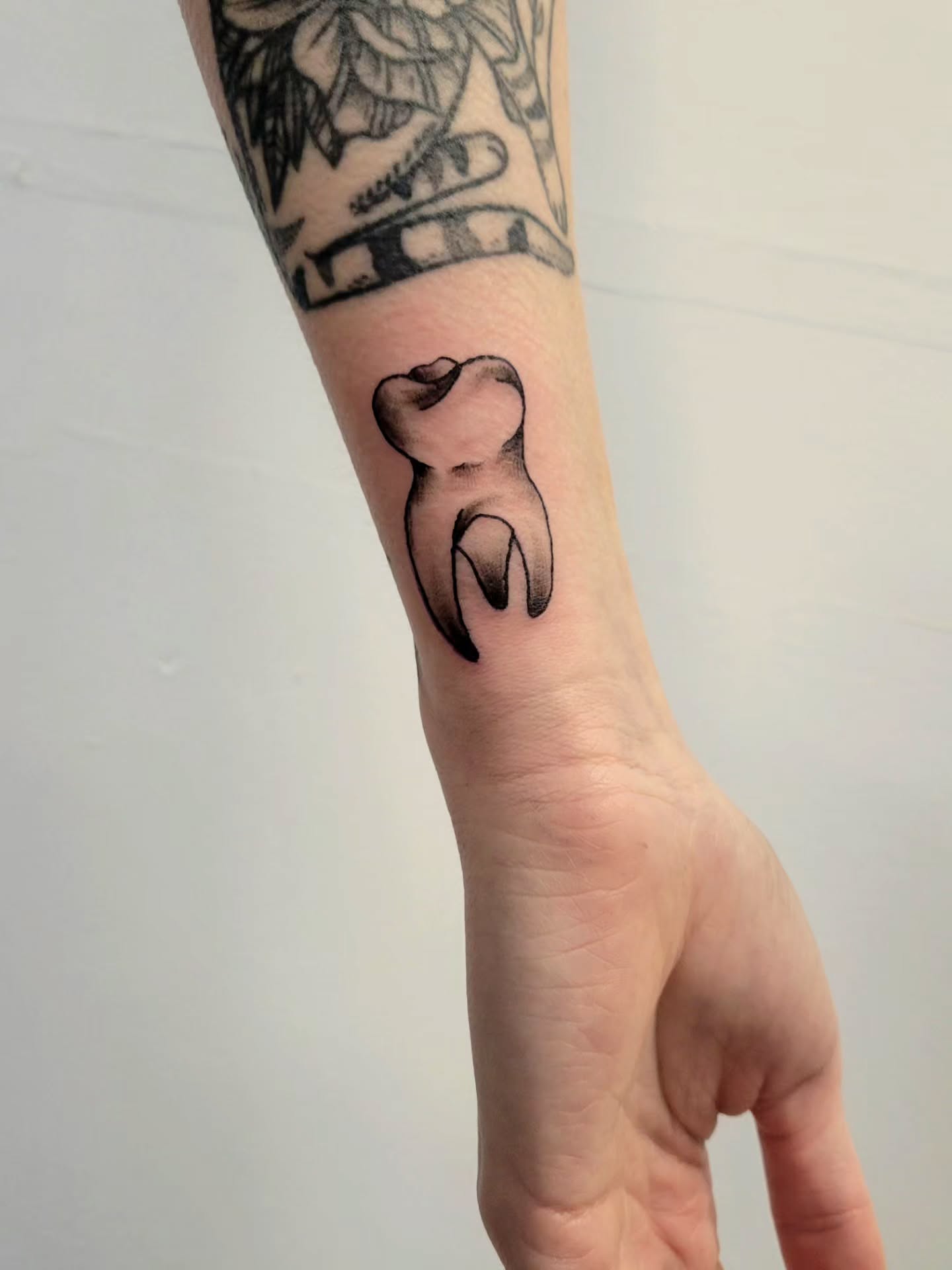 Tooth black and grey tattoo on the forearm by Kyle - Portland Oregon Tattoo Artist