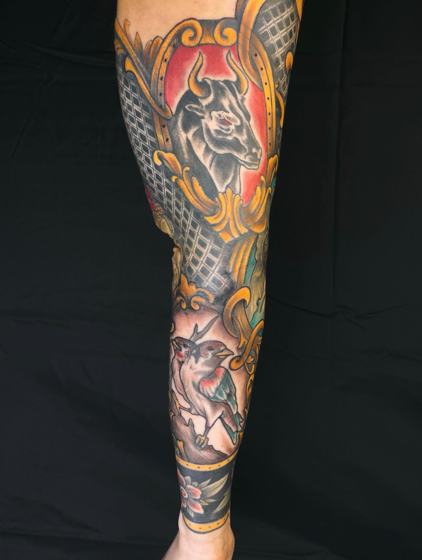 Bull and bird American traditional tattoo on the forearm by Brookelyn