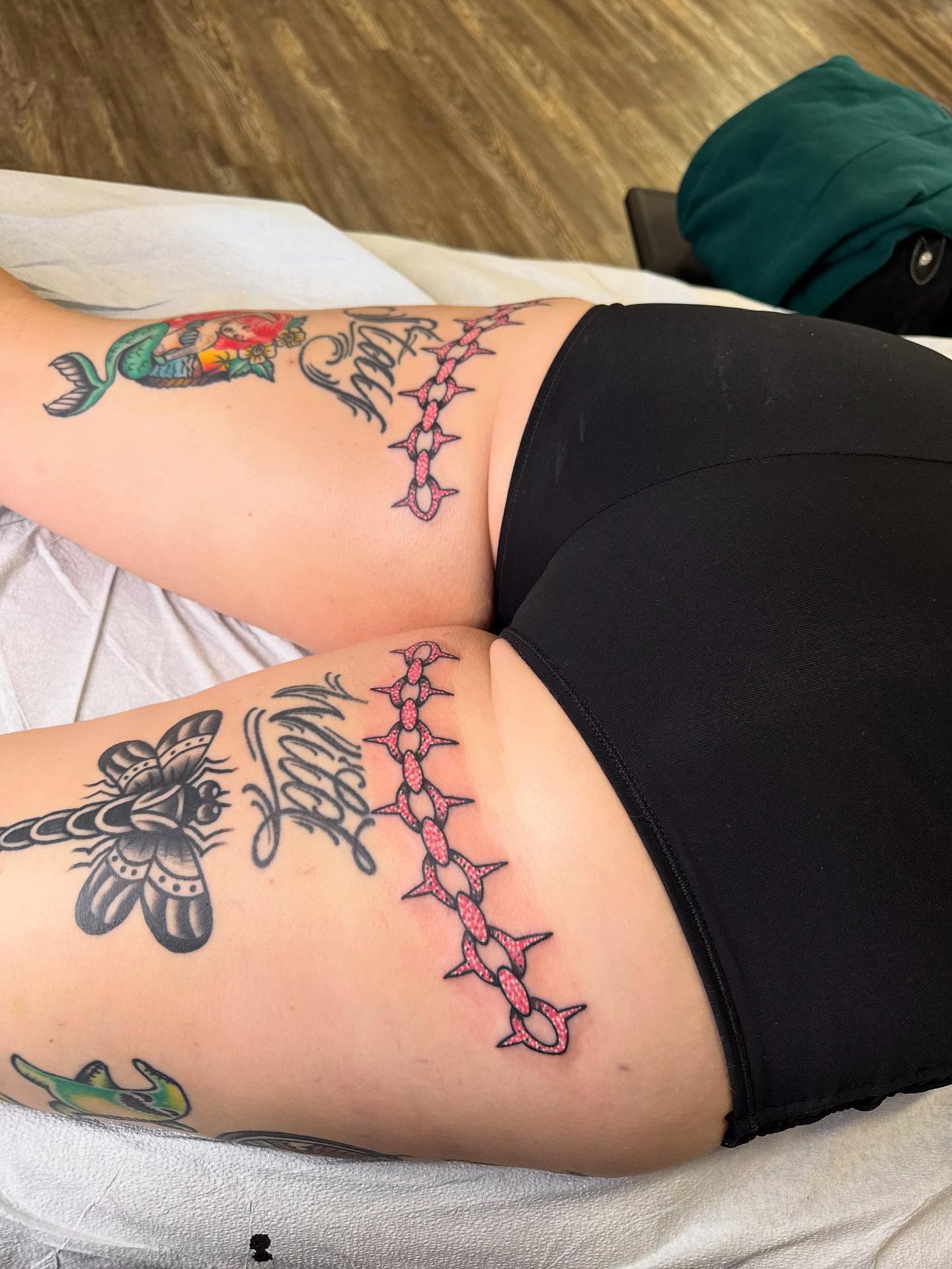 Barbed wire neo-traditional tattoo on the thigh by Brandon Heredia, Vacaville, California