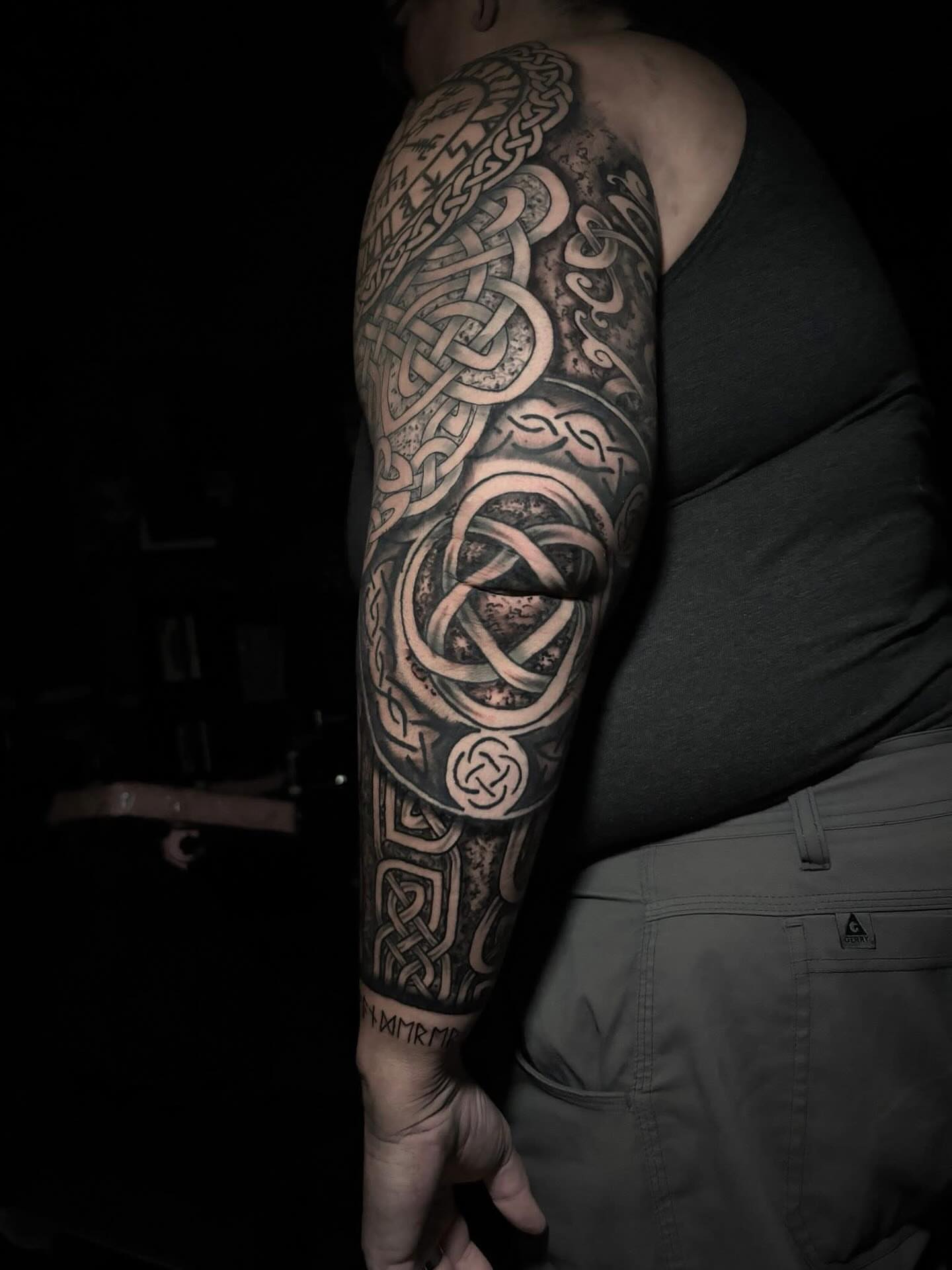 Celtic knotwork geometric tattoo on the forearm by Ashley Denise