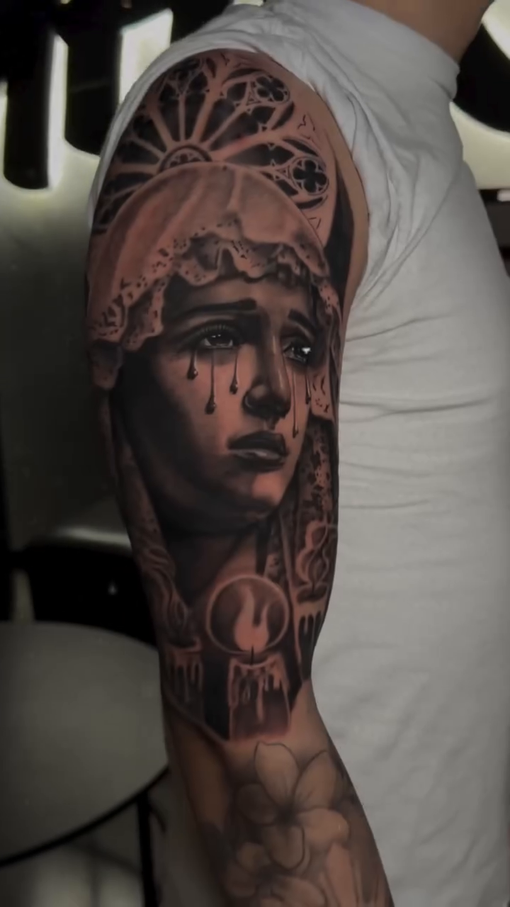 A crying woman with candles realism tattoo by Charlotte Tattoo Artist