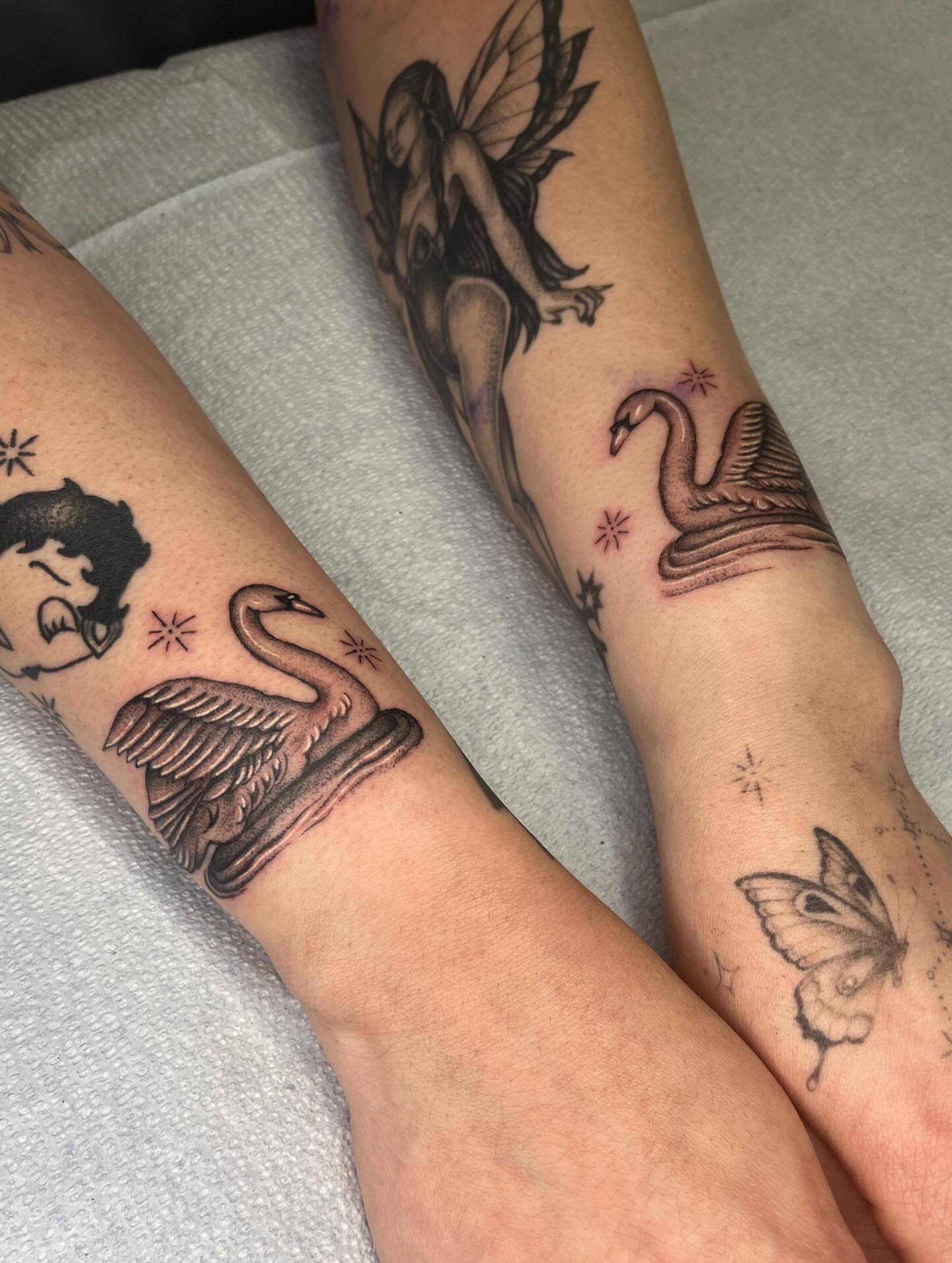 Swan and fairy realism tattoo on the forearm by The One Who’s Always Drawing