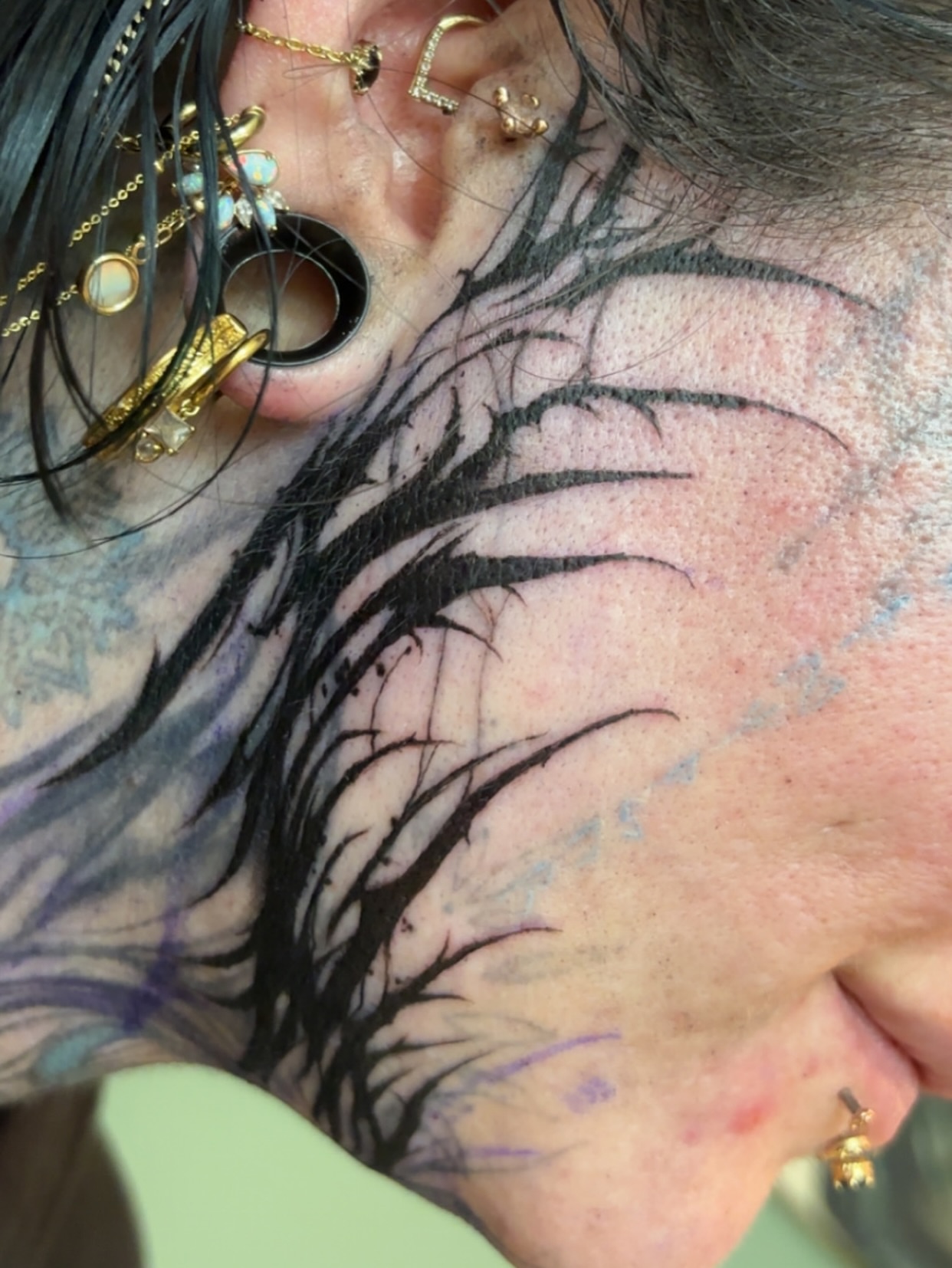 Abstract tree black and grey tattoo on the neck by Ivanna