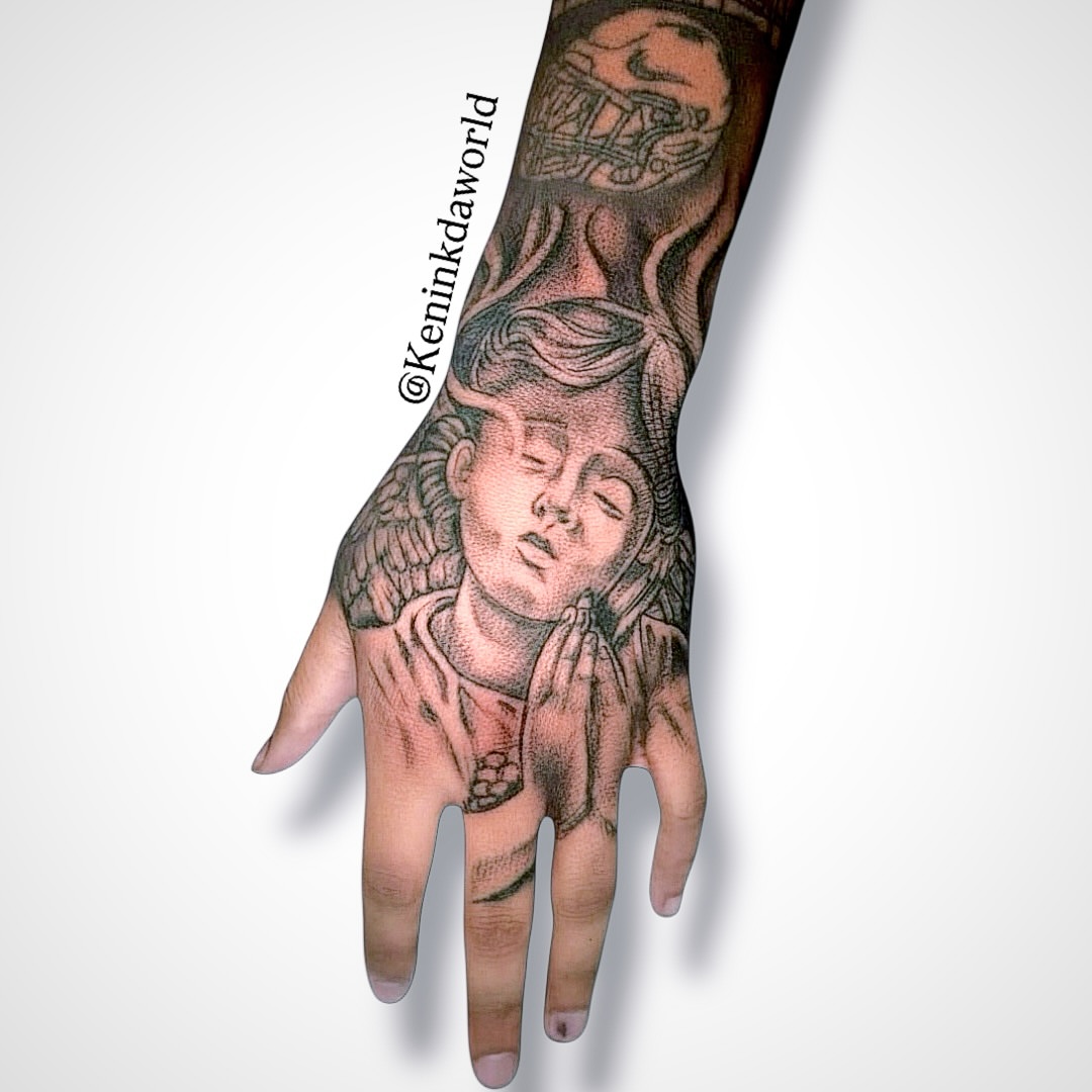 Praying angel dotwork tattoo on the hand by Ken West