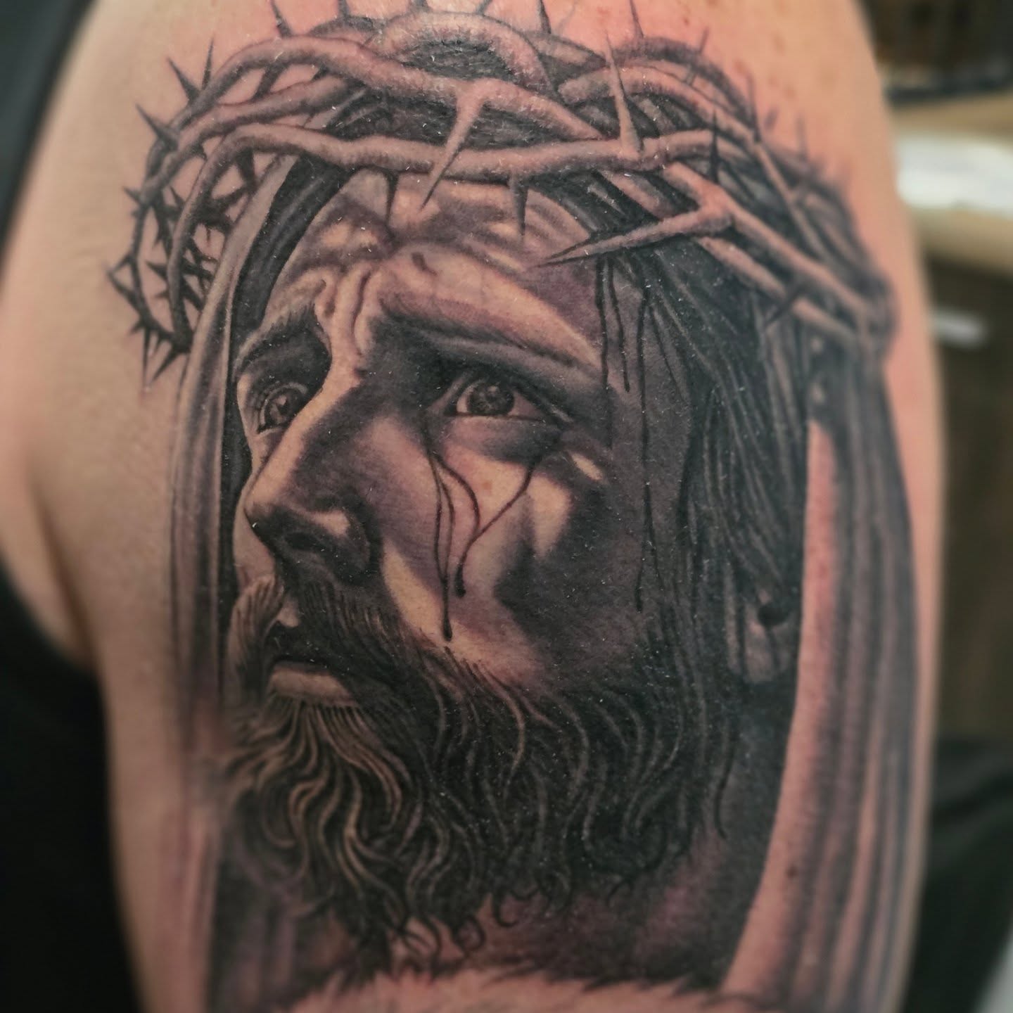 Jesus Christ realism tattoo on the shoulder by Martin Colonna