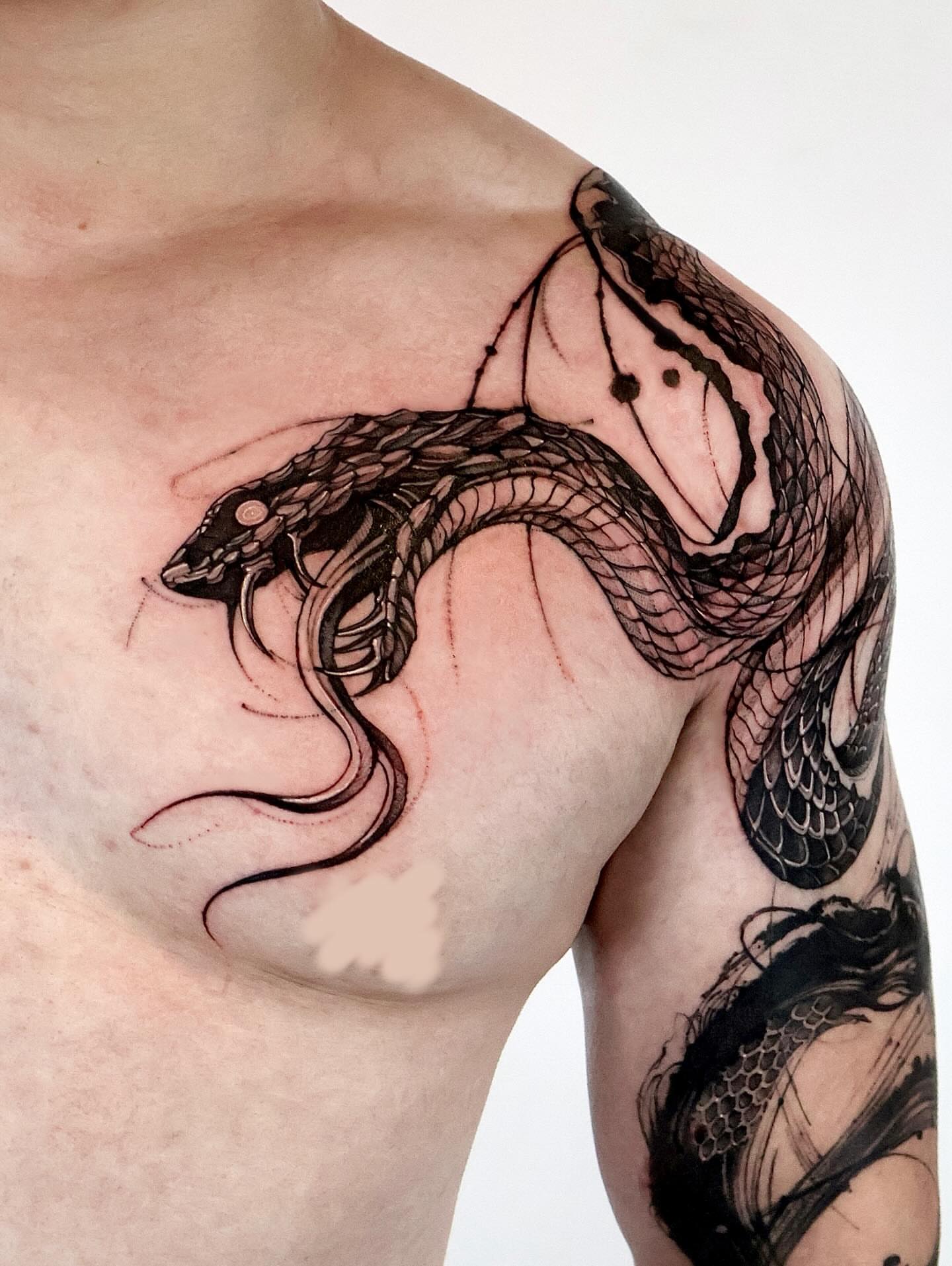 Snake black and grey tattoo on the shoulder by Tadi