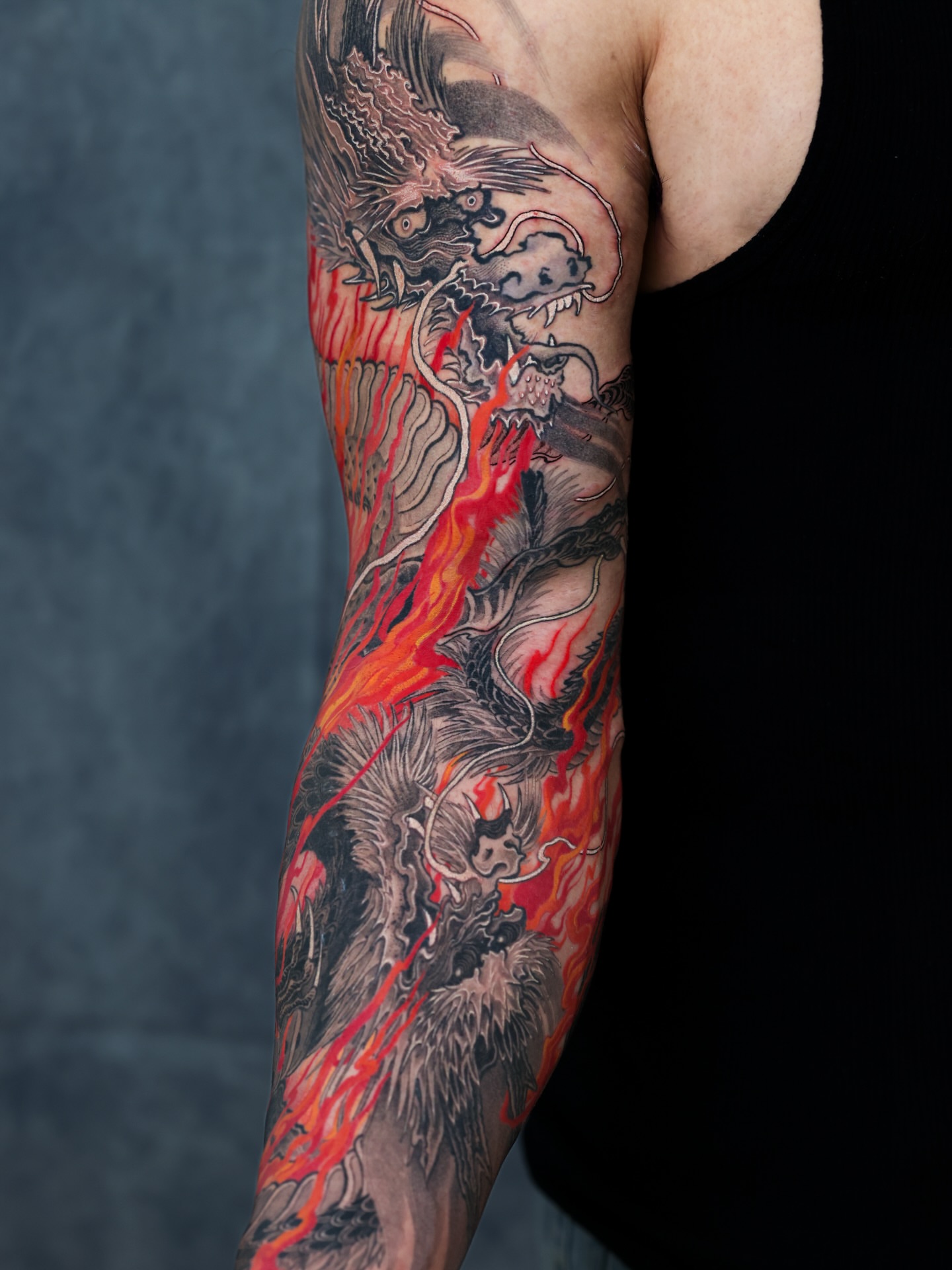 Fire-breathing dragon japanese irezumi tattoo on the forearm by Swani