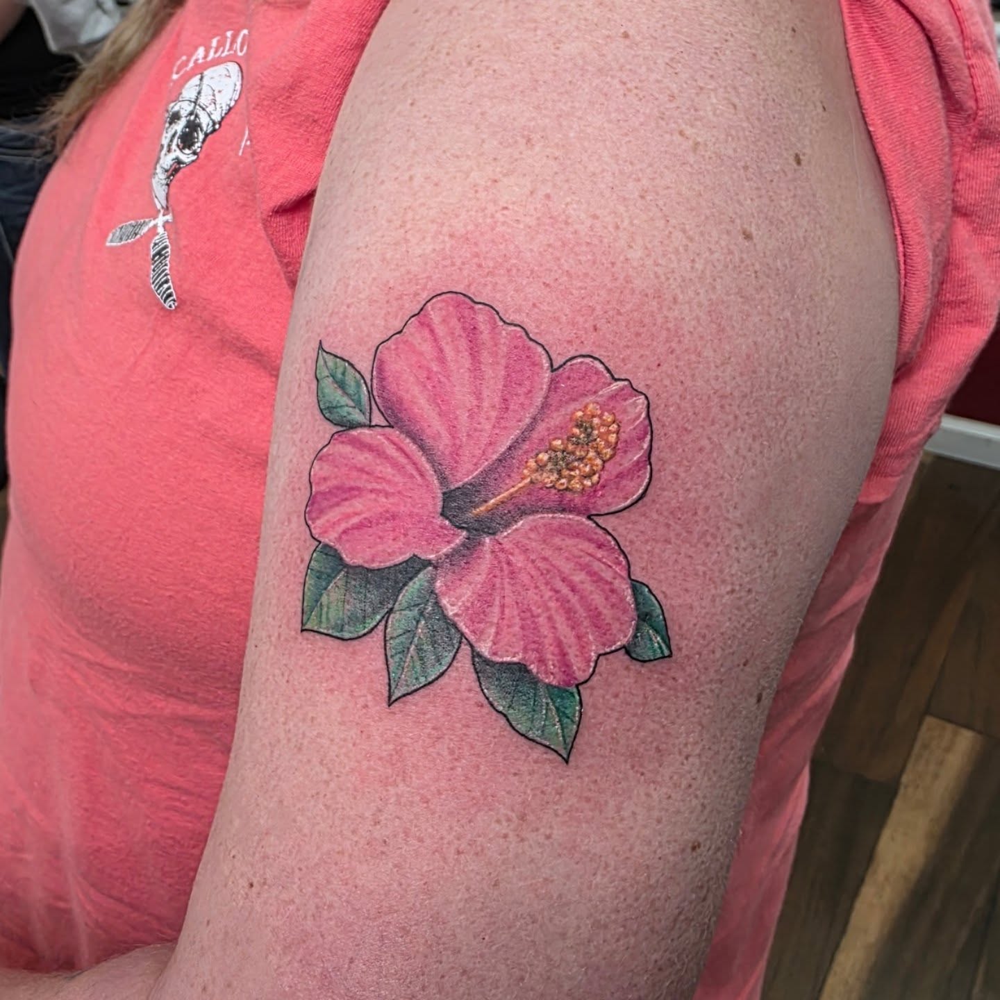 Hibiscus flower realism tattoo on the shoulder by Bosco Layne