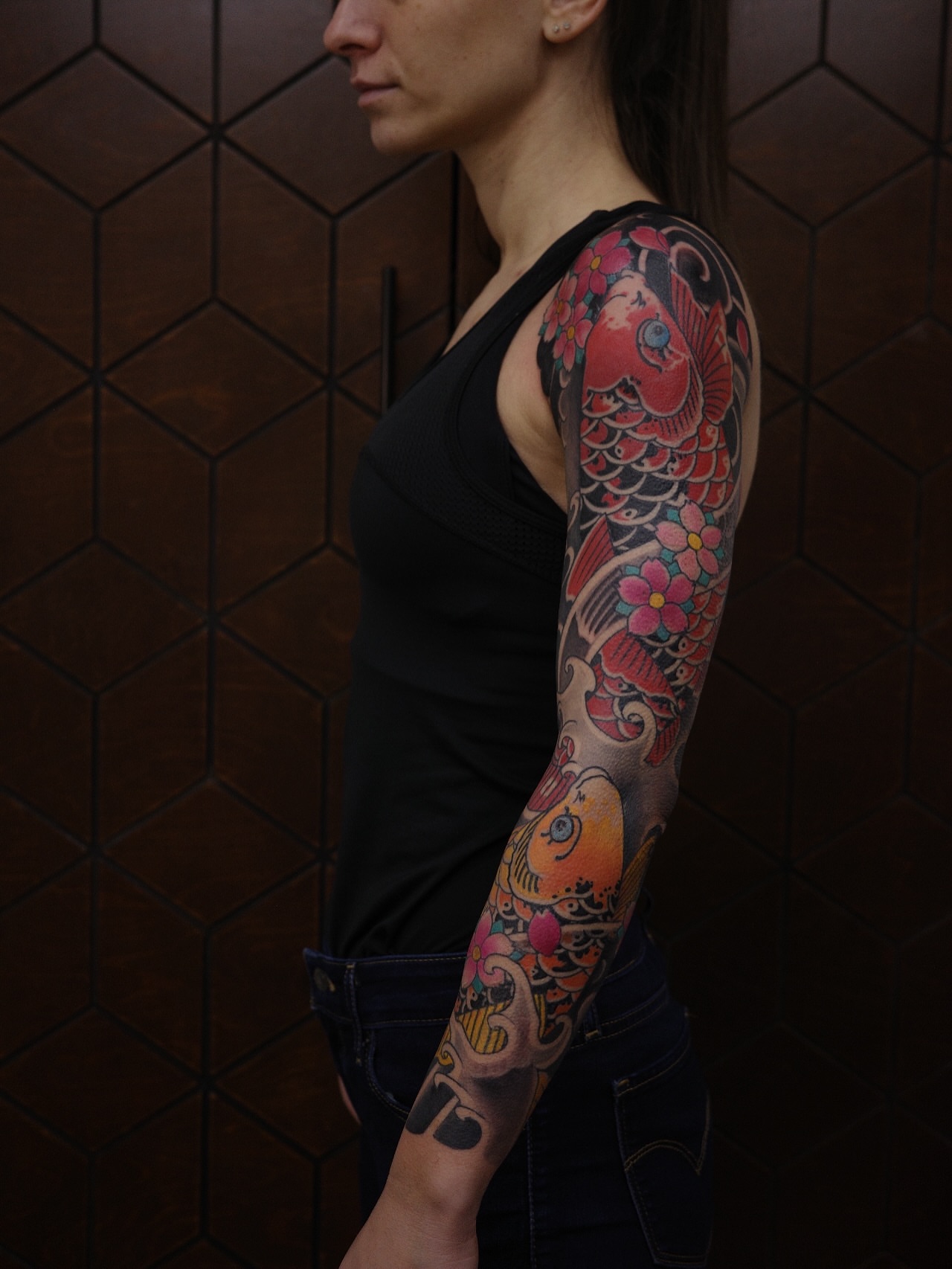 Koi fish and floral japanese irezumi tattoo on the upper arm by Innokenty Meshchakov, Portland, Oregon