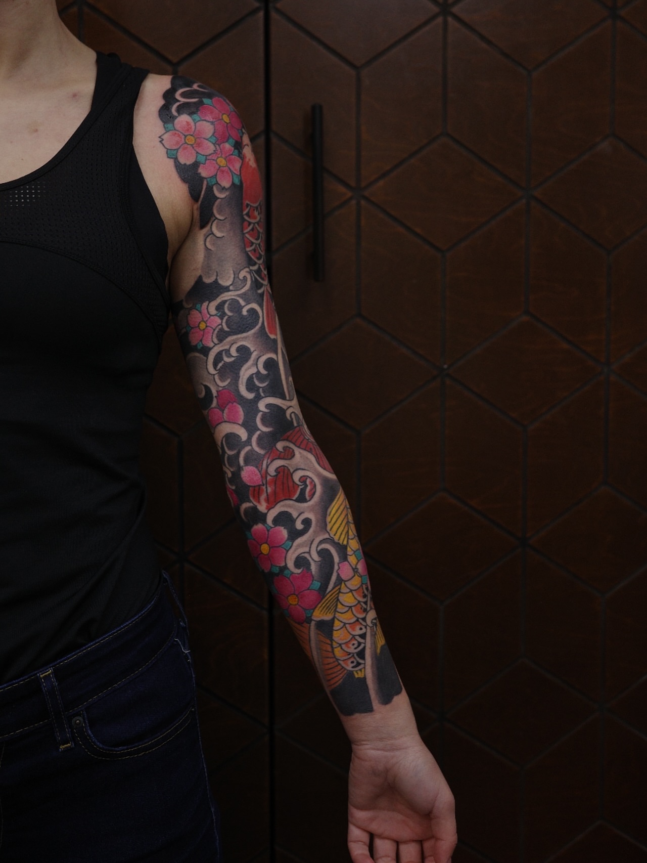 Cherry blossoms and koi fish japanese irezumi tattoo on the forearm by Innokenty Meshchakov, Portland, Oregon