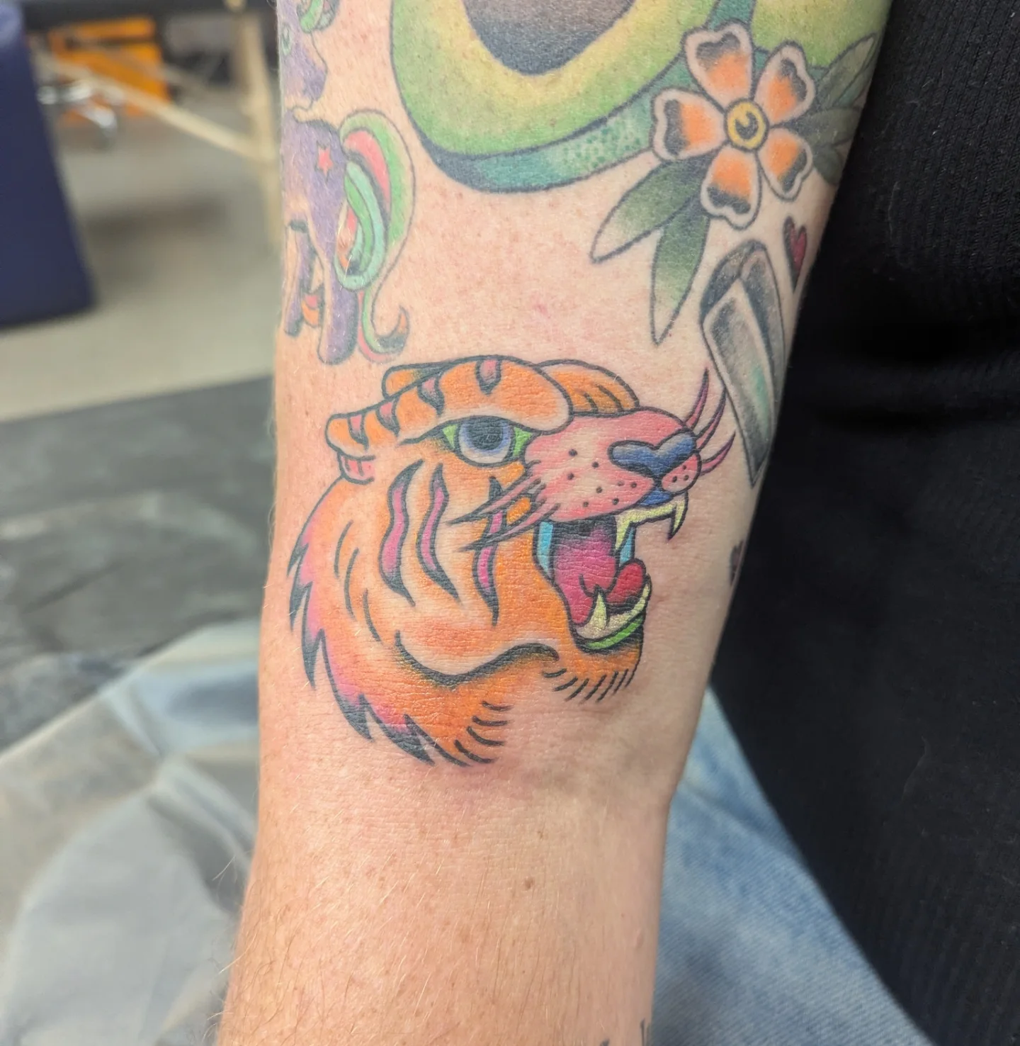 Tiger head American traditional tattoo on the forearm by ♡ Cora ♡