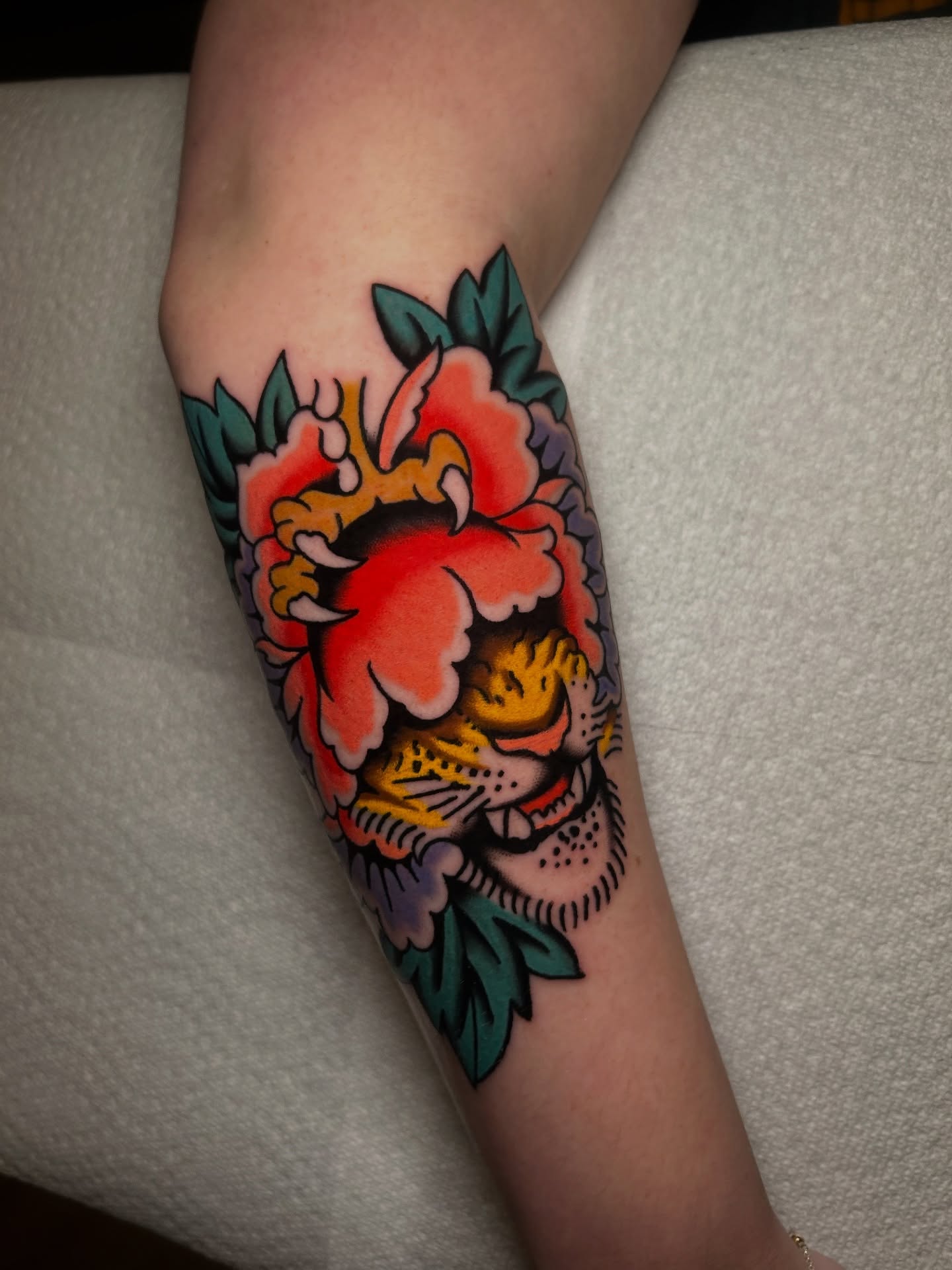 Peony flower American traditional tattoo on the forearm by Mitch Hoggard