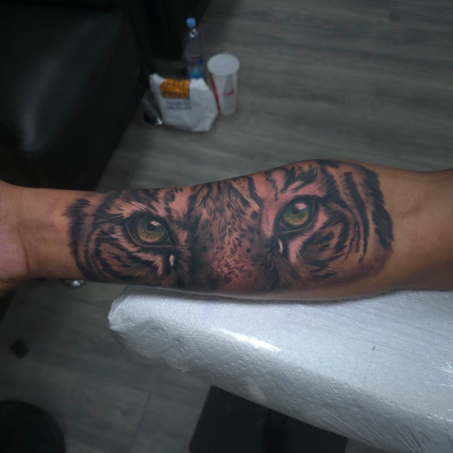 Tiger eyes realism tattoo on the forearm by Joseph J Tattooart Denver, Lakewood, Colorado