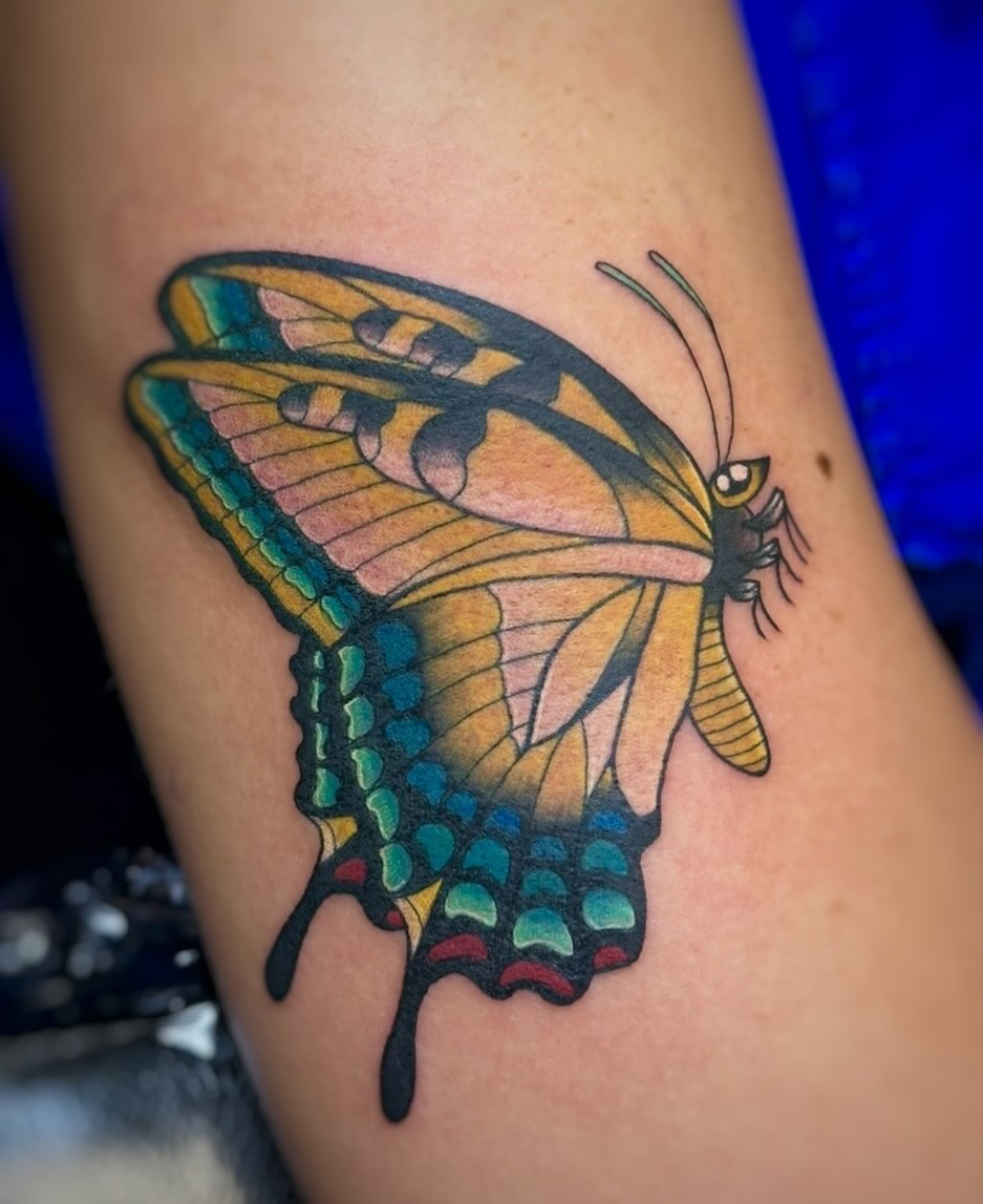 Butterfly American traditional tattoo on the thigh by 𓍊𓋼 Joana Diane Tattoos 𓋼𓍊