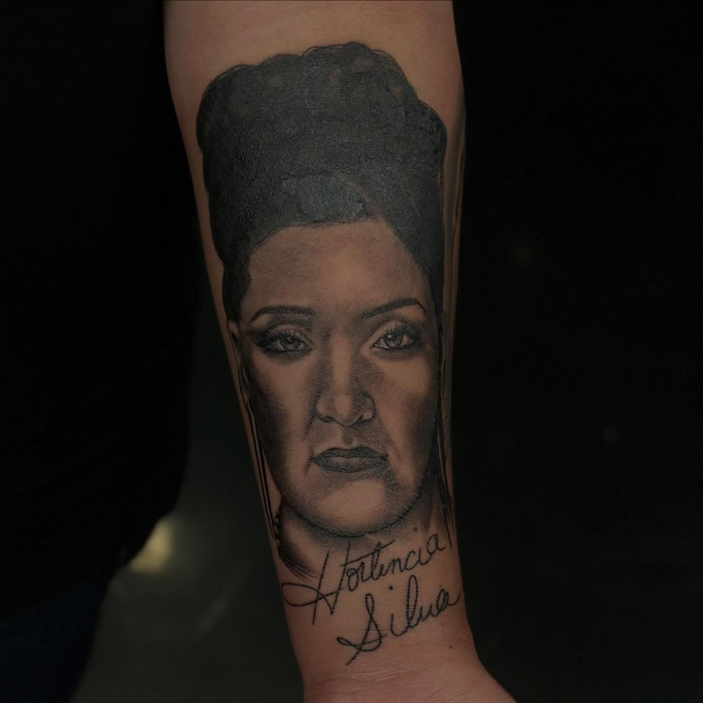 Portrait realism tattoo on the forearm by Lissy Red
