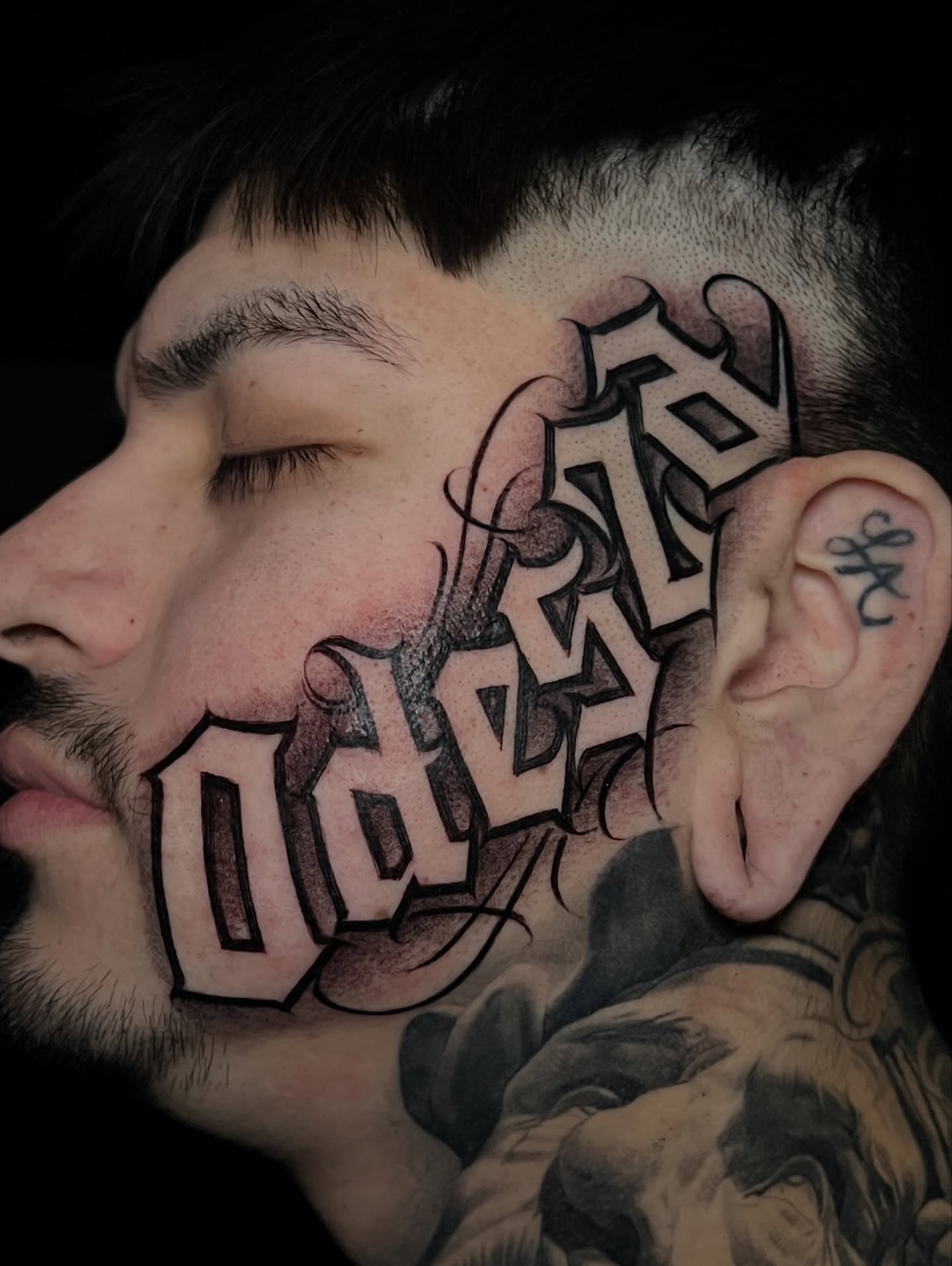 Lettering lettering script tattoo on the head by Flames, Cerritos, California