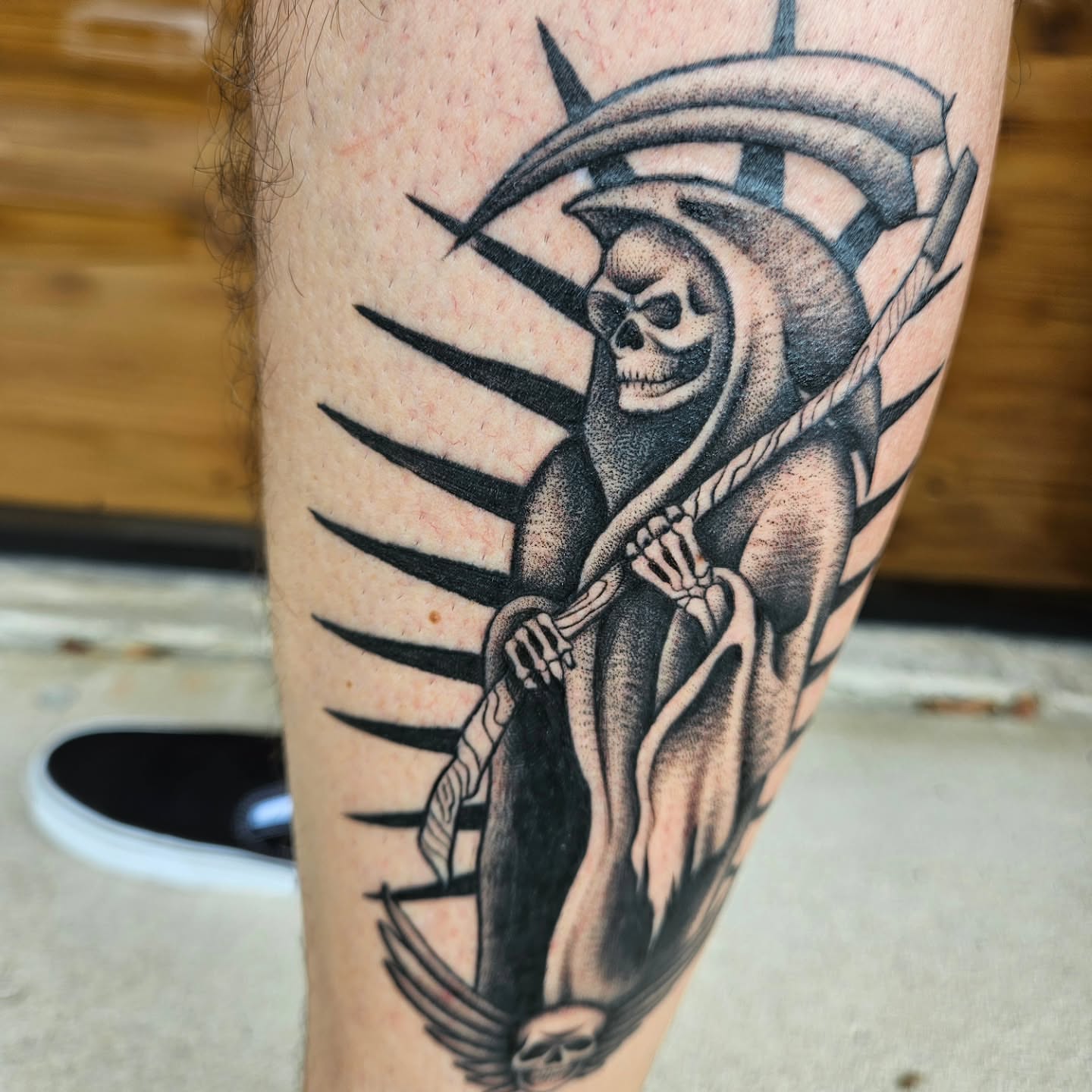Grim reaper black and grey tattoo on the leg by Kelly Zito