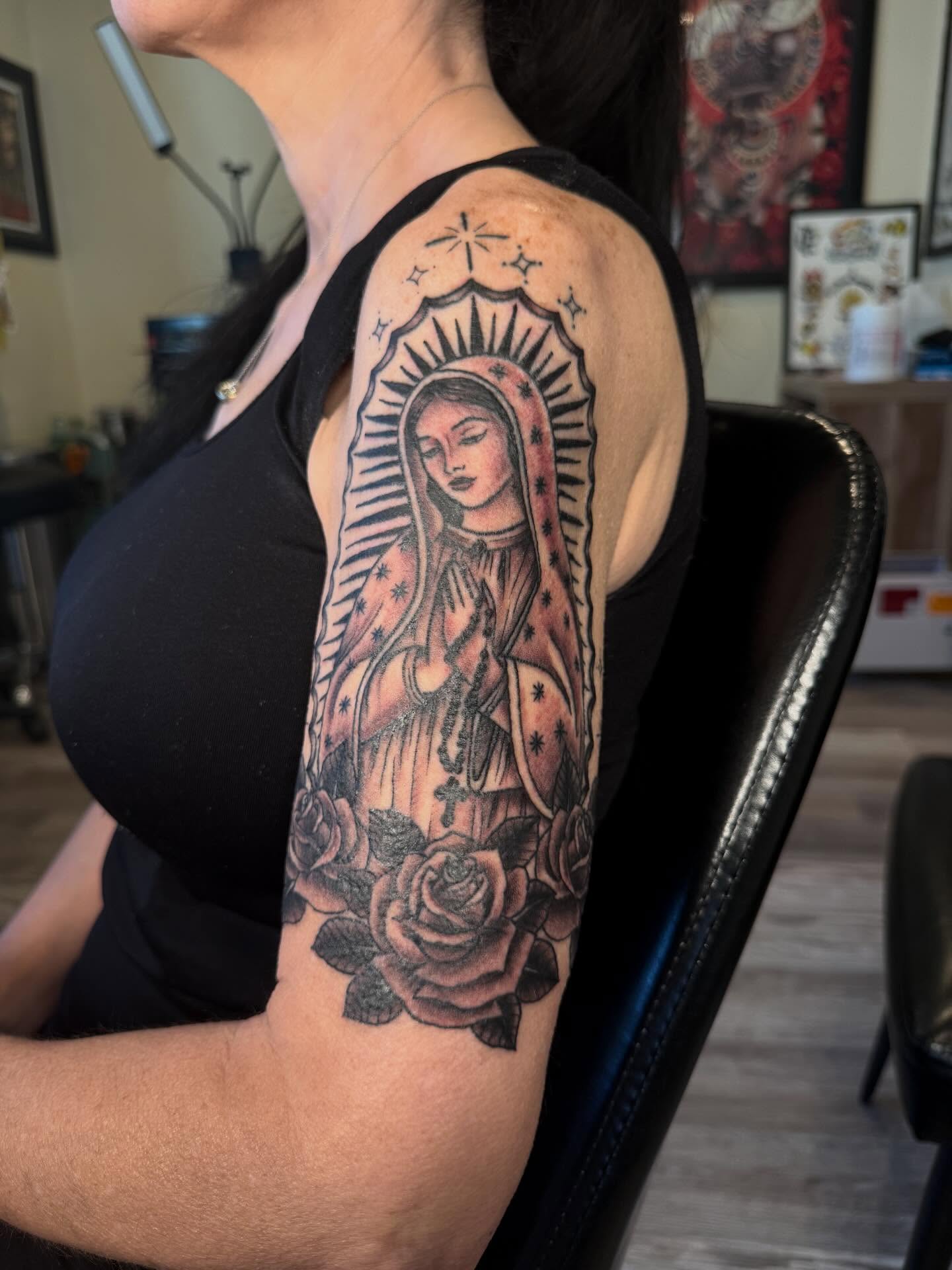 Our Lady of Guadalupe American traditional tattoo on the upper arm by Rebecca Basma Smith