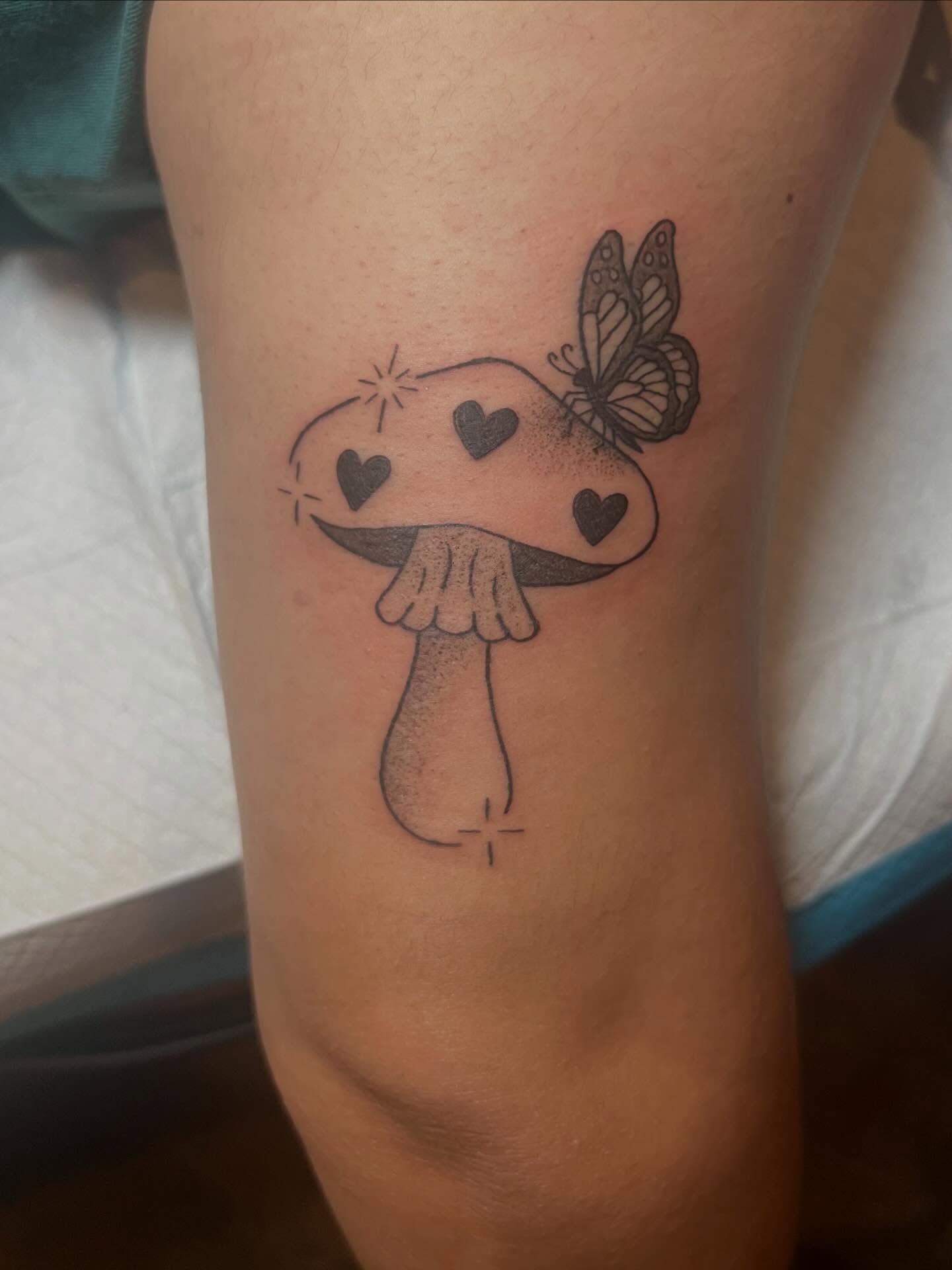 Mushroom with hearts dotwork tattoo on the forearm by zoie rozay hannah