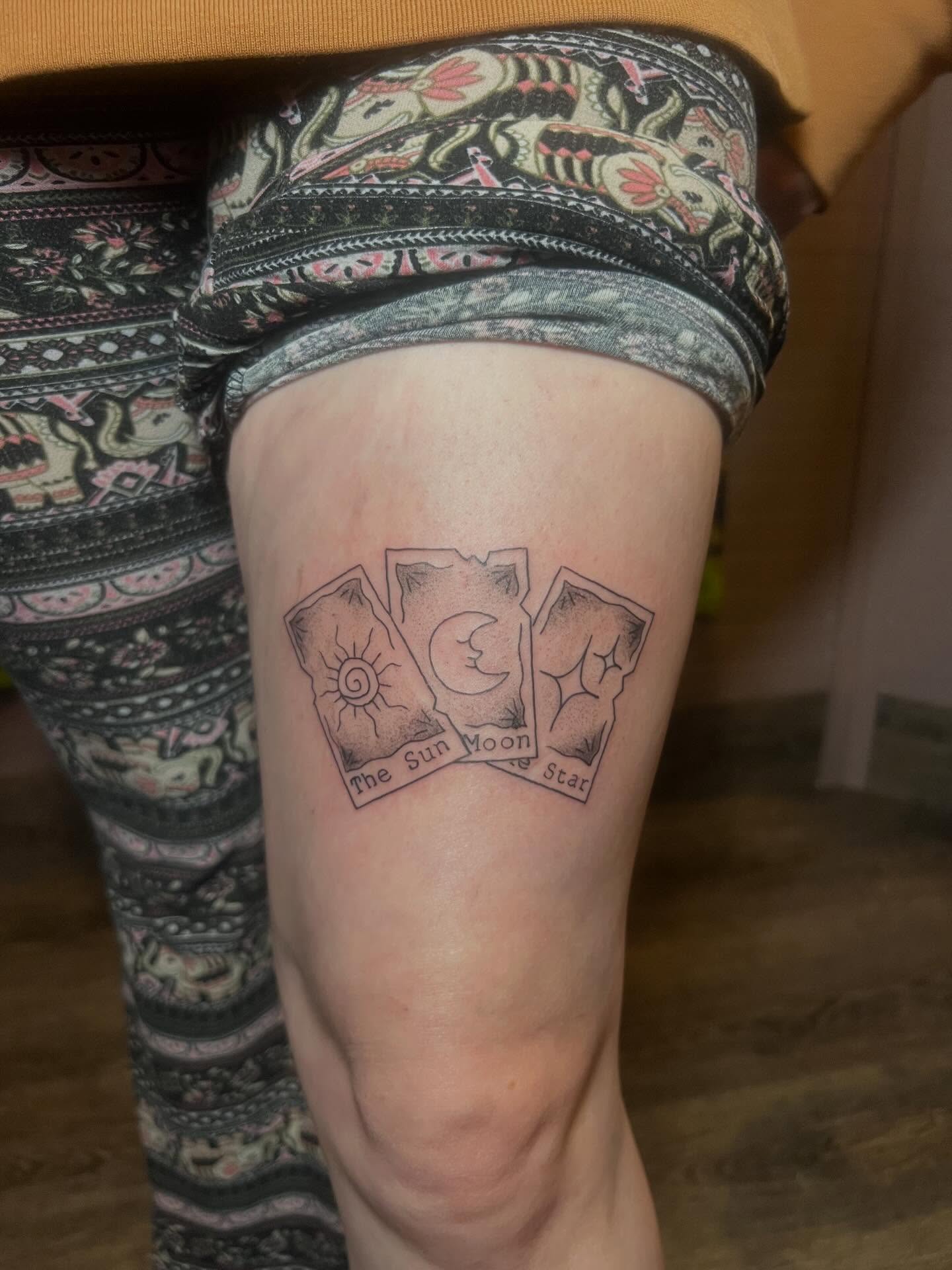 Tarot cards black and grey tattoo on the thigh by zoie rozay hannah