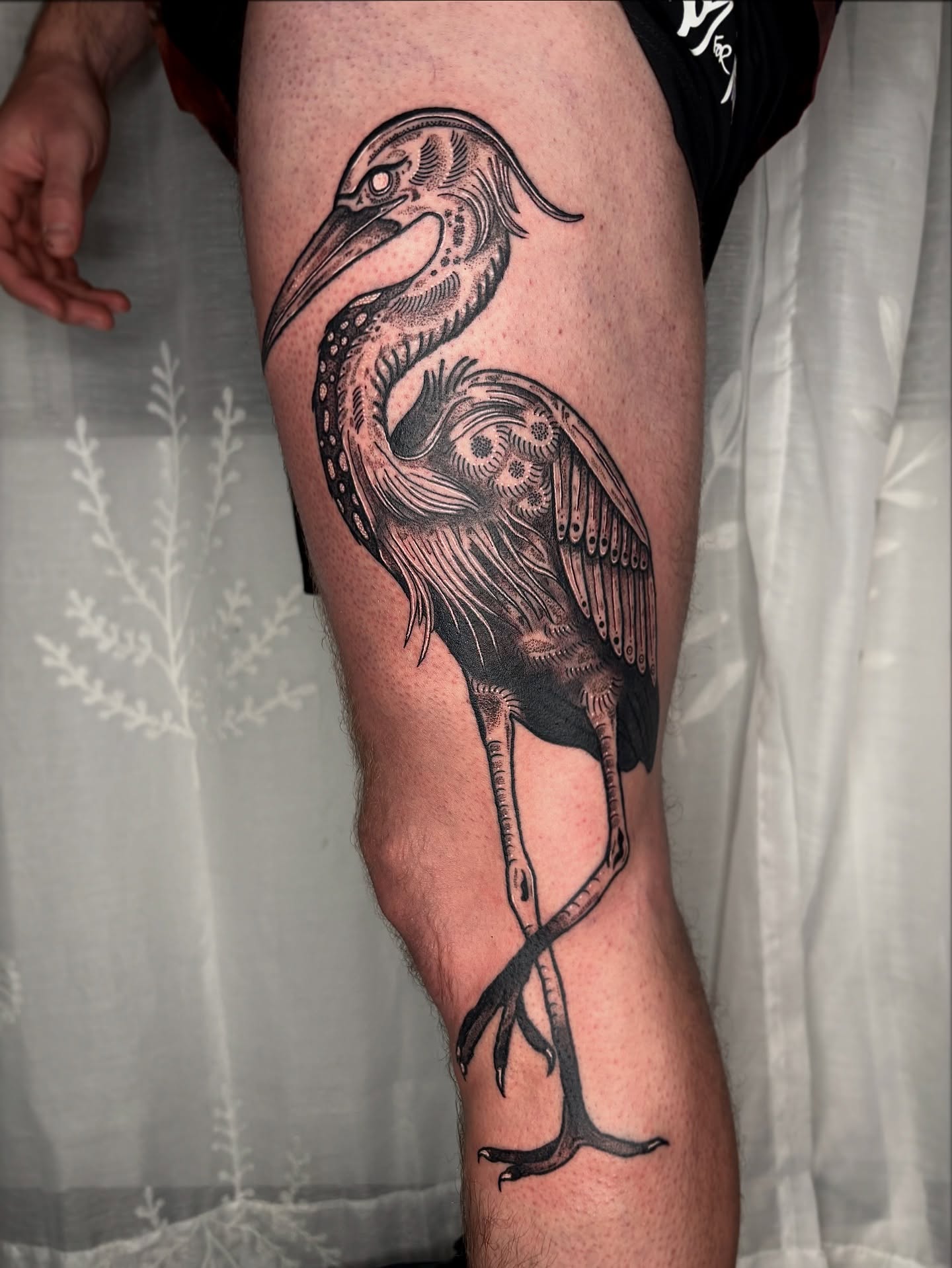 Heron black and grey tattoo on the thigh by destiney rose
