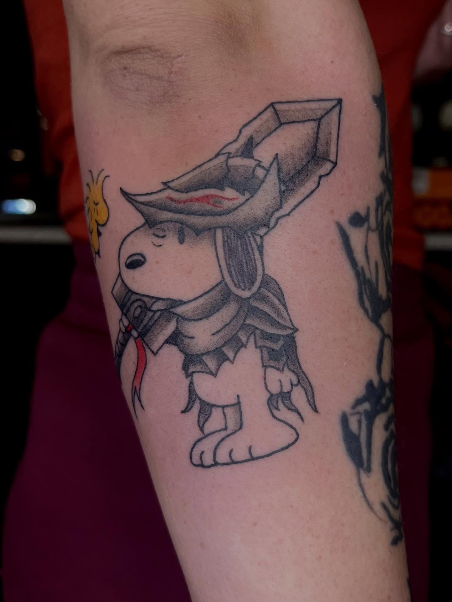 Snoopy in armor black and grey tattoo on the forearm by Chase Healey, Salt Lake City, Utah