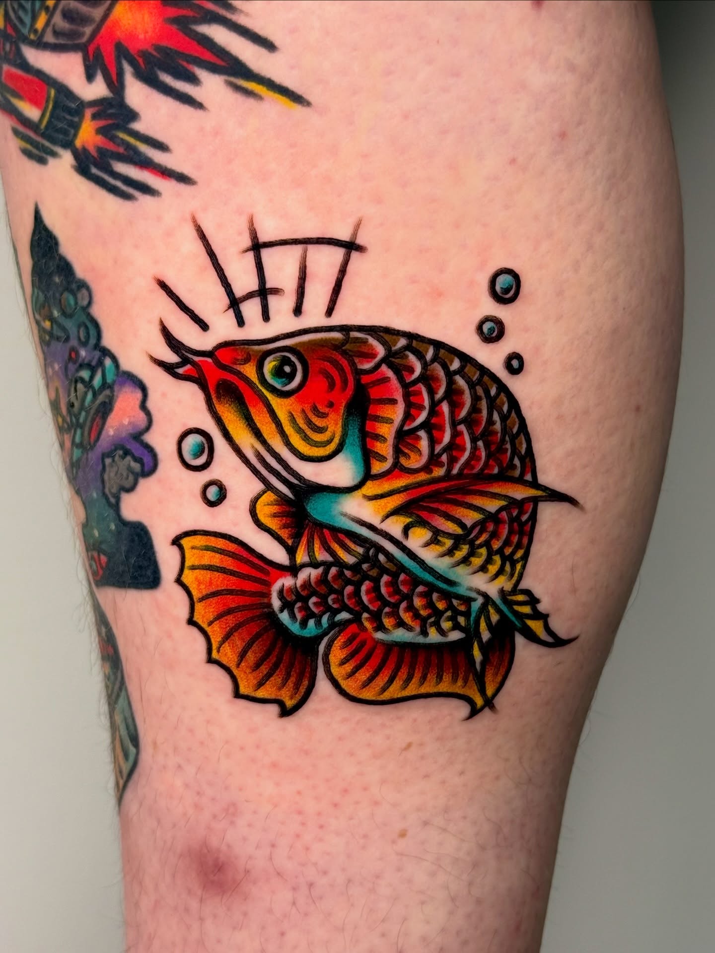 Koi fish American traditional tattoo on the thigh by Tattooer Sancho 🇰🇷🇨🇦